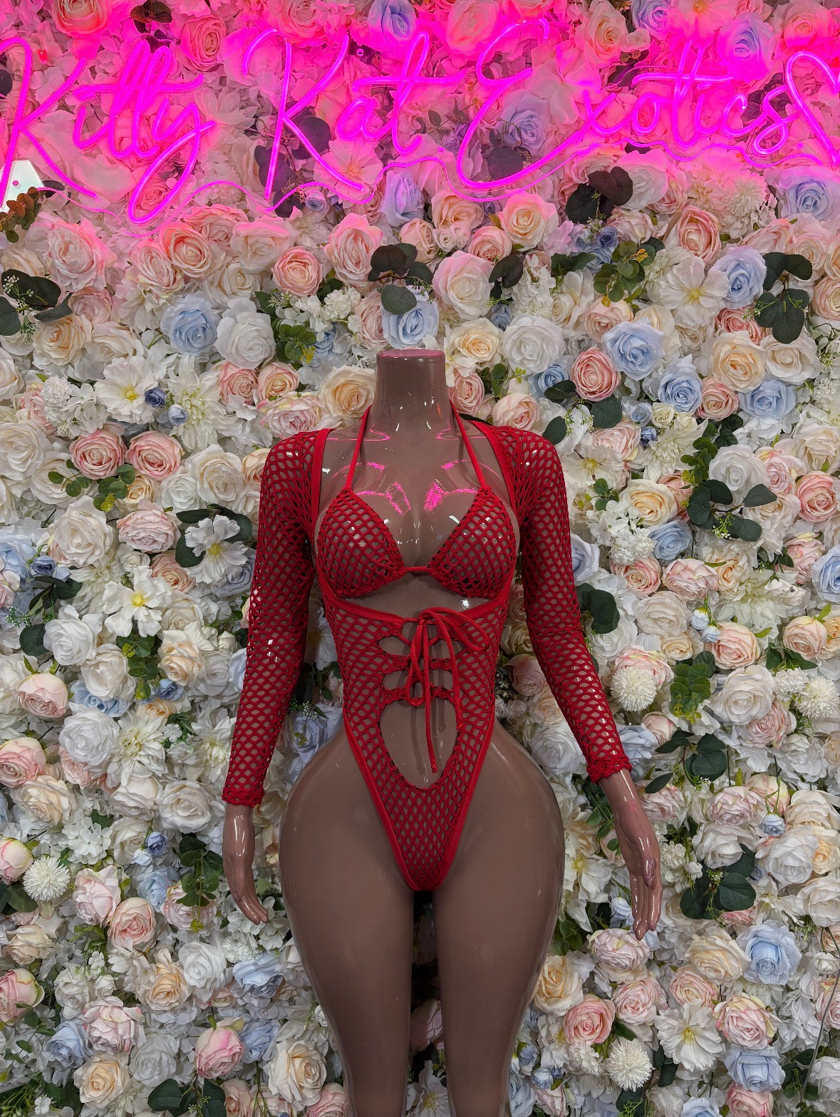Red fishnet bodysuit with long sleeves, lace-up neckline, keyhole cutout