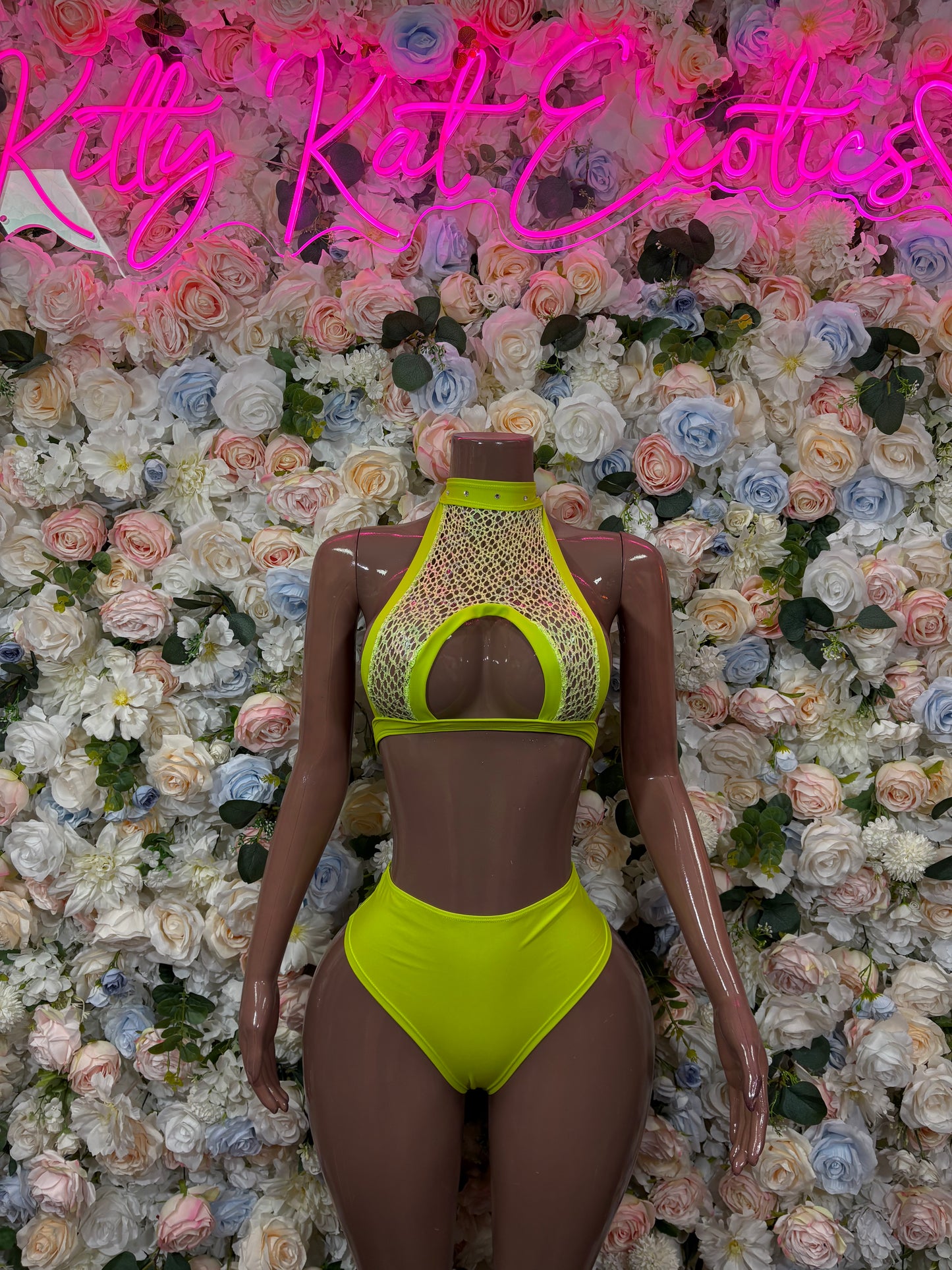 Neon lime green rave two-piece set with halter bikini top and high-cut bottoms