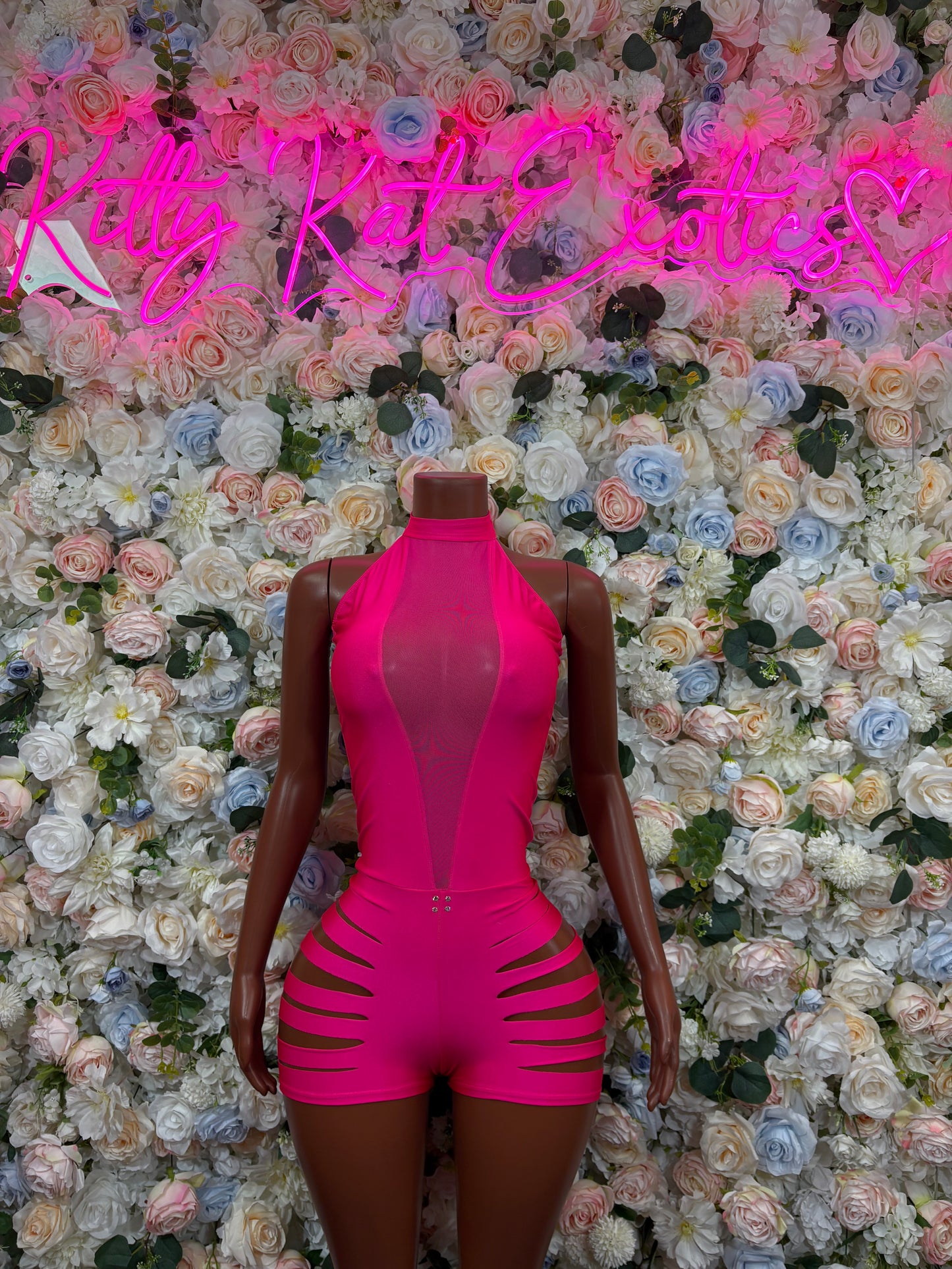 Pink bodysuit with halter neck, deep front cutout and striped hip cutouts
