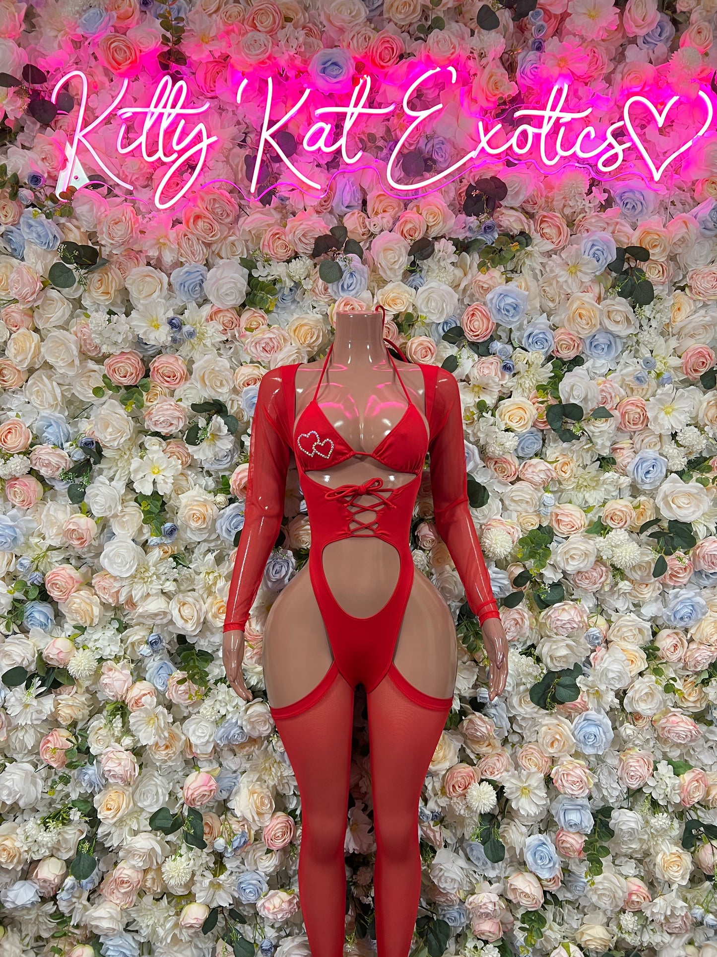 Red heart bodysuit with long sleeves, heart cutout and lace-up front