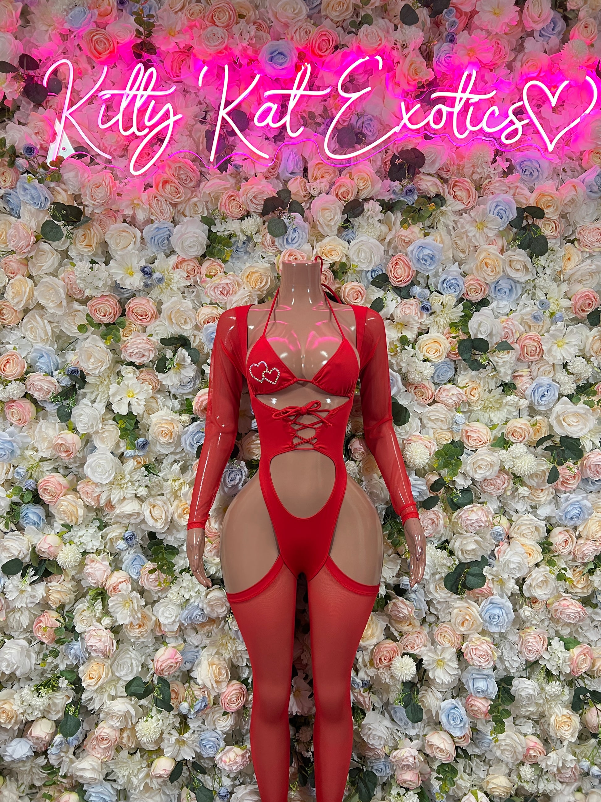 Red heart bodysuit with long sleeves, heart cutout and lace-up front