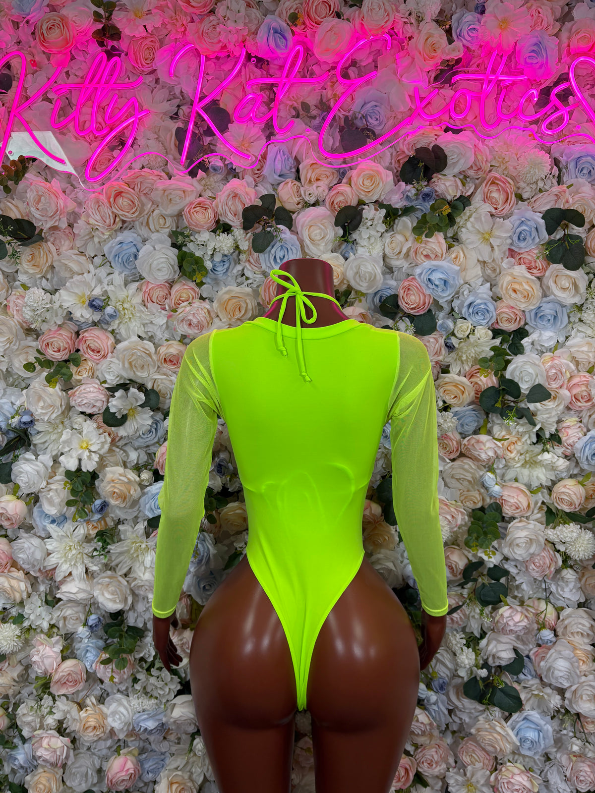 Neon green long-sleeve bodysuit with high neck