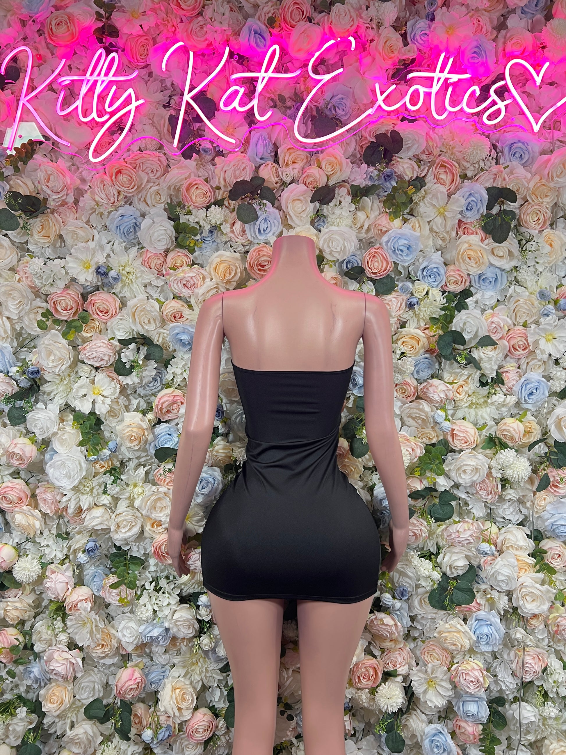 Black strapless mini dress with draped back ruching and cinched waist