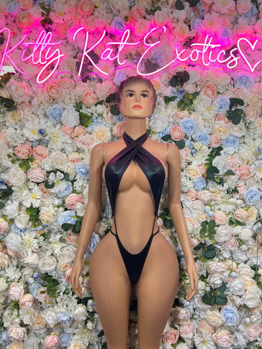Black matte latex halter bodysuit with deep chest cutout and crisscross neckline