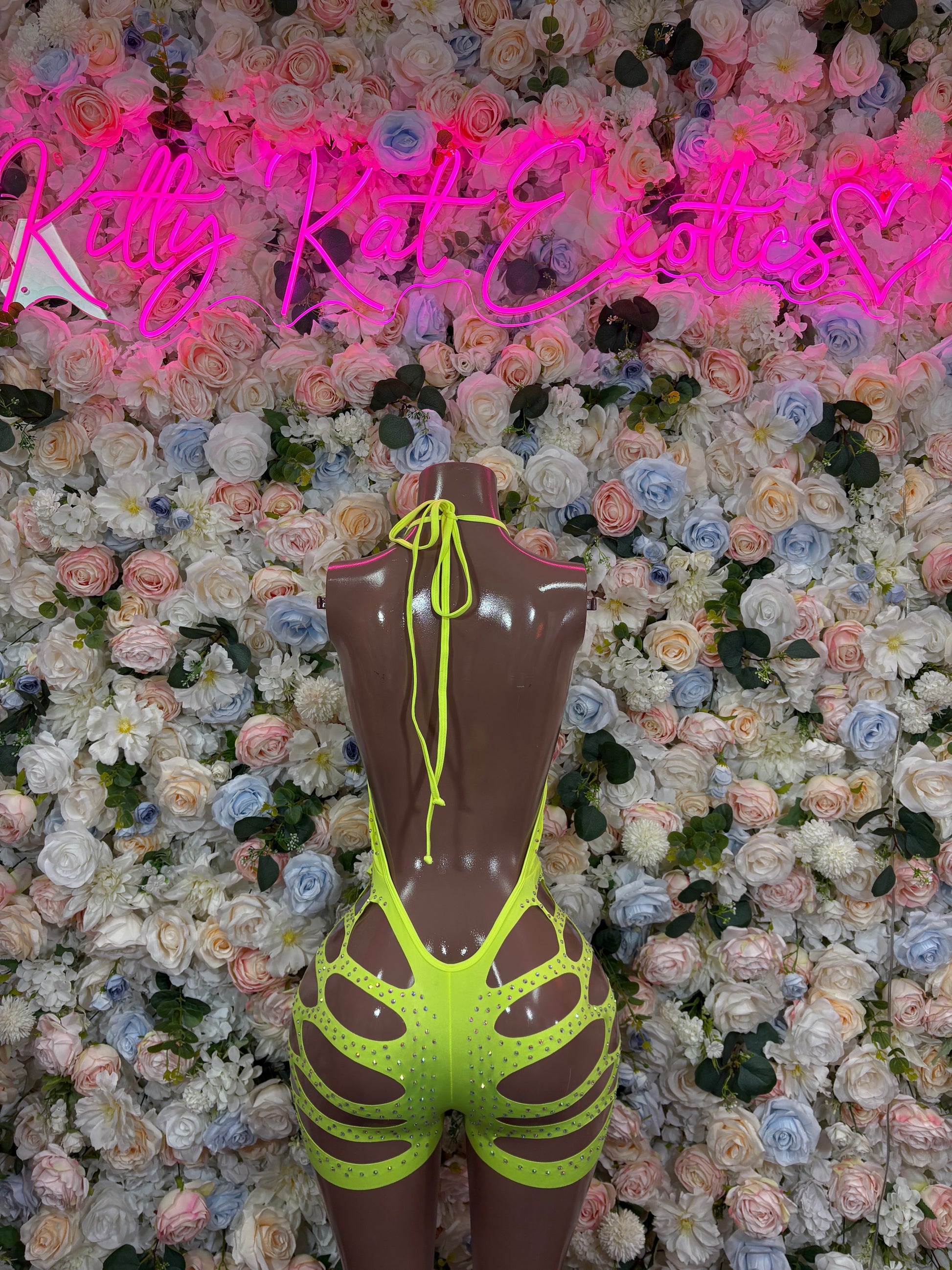 Neon green rhinestone bodysuit with cutout sides and plunging front