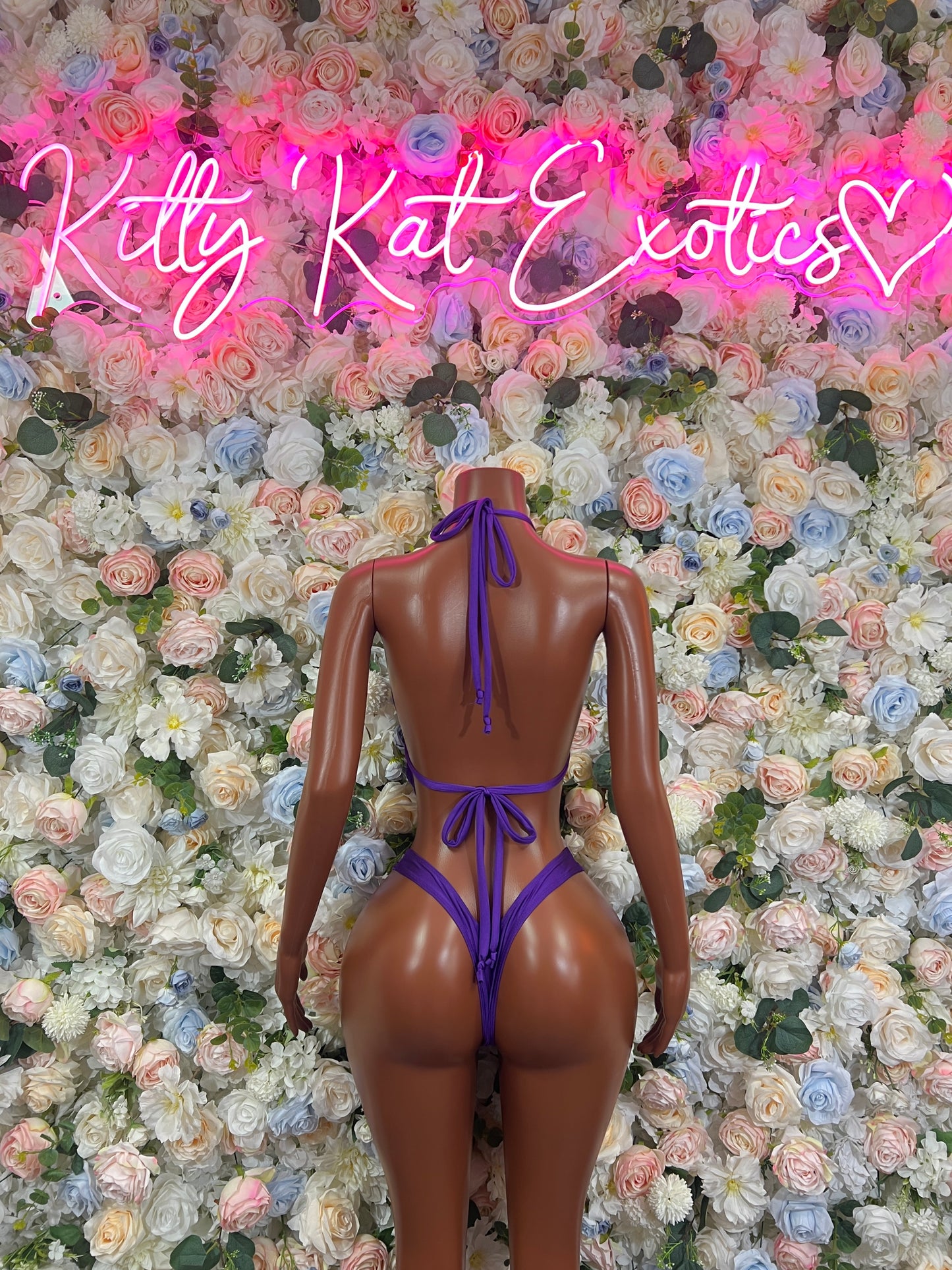 Purple halter bodysuit with open back and ribbon tie details