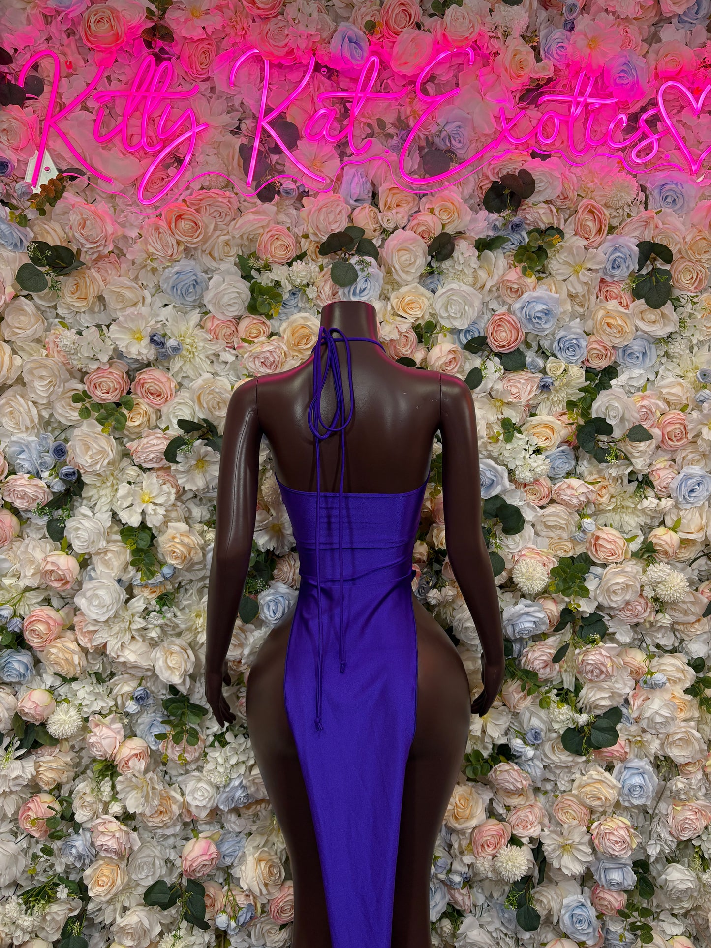 Backless purple halter maxi gown with crisscross straps and tied open back