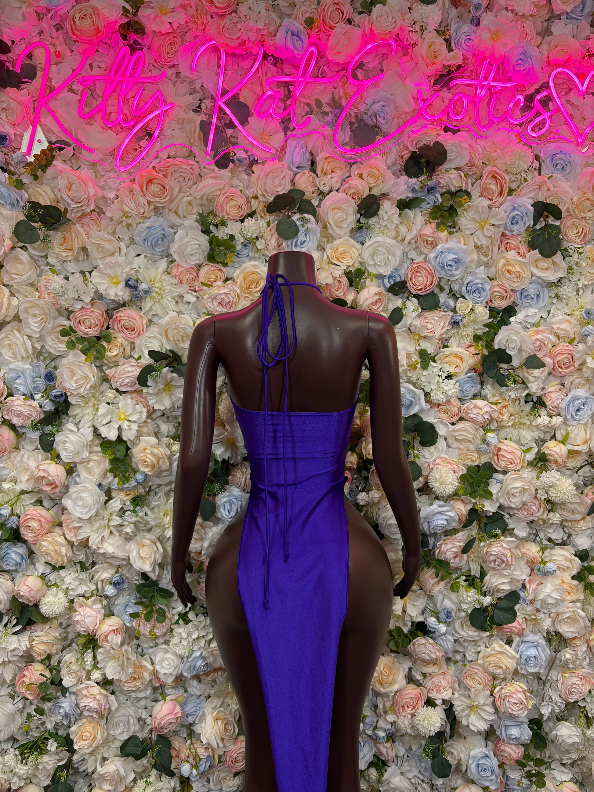 Backless purple halter maxi gown with crisscross straps and tied open back