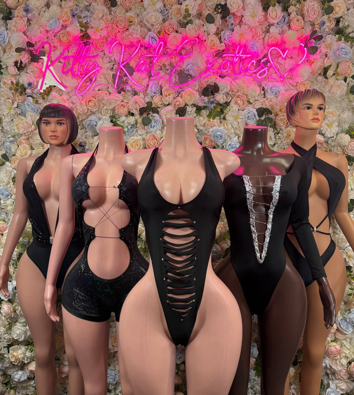 Black metallic cutout bodysuit on models, halter neckline and open sides
