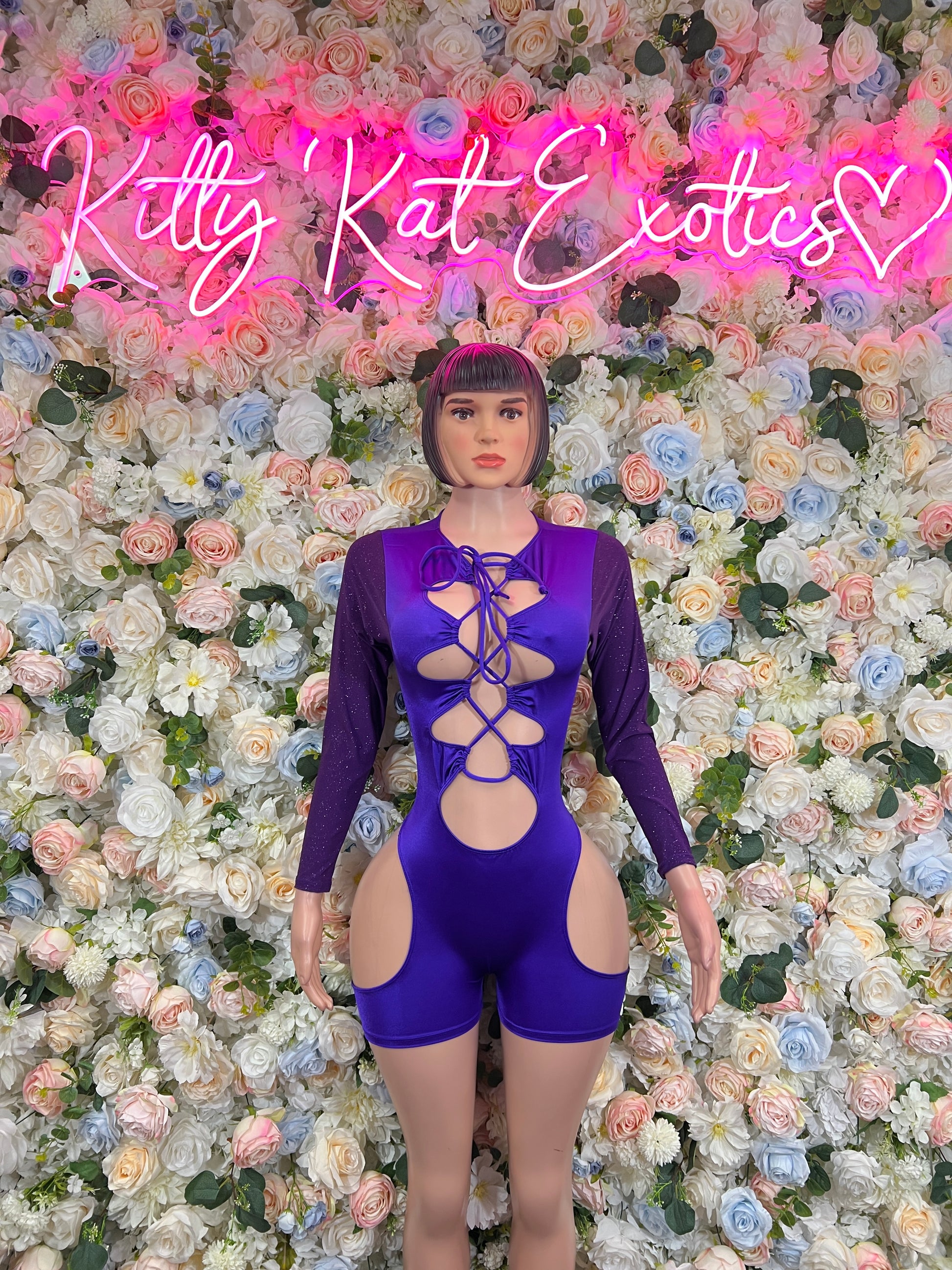 Purple long-sleeve lace-up bodysuit with open back and cheeky shorts