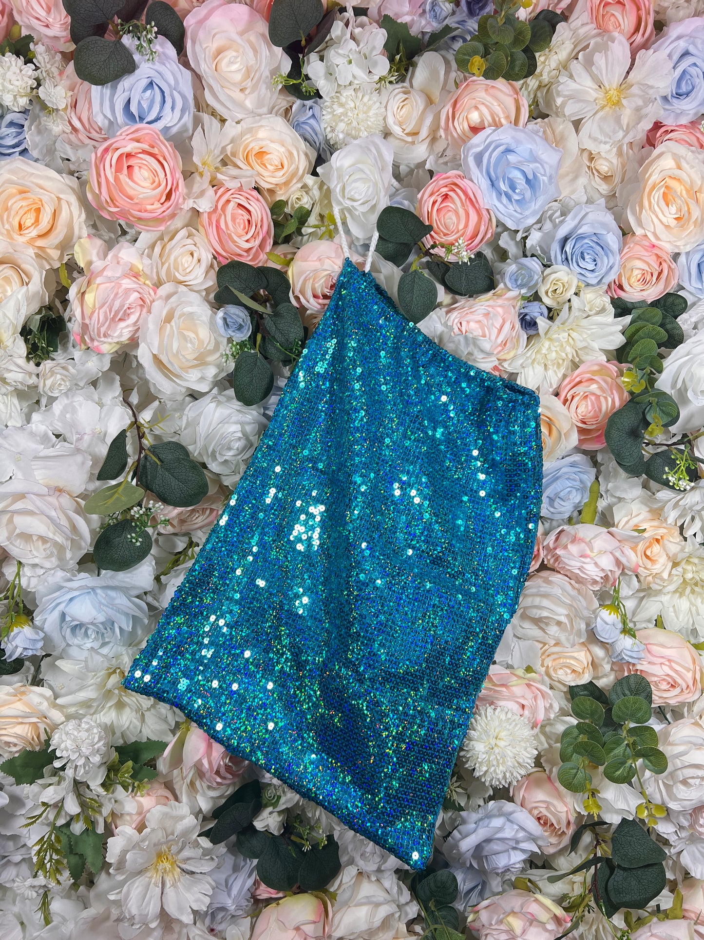 Turquoise sequin money bag pouch with top handle, angled view