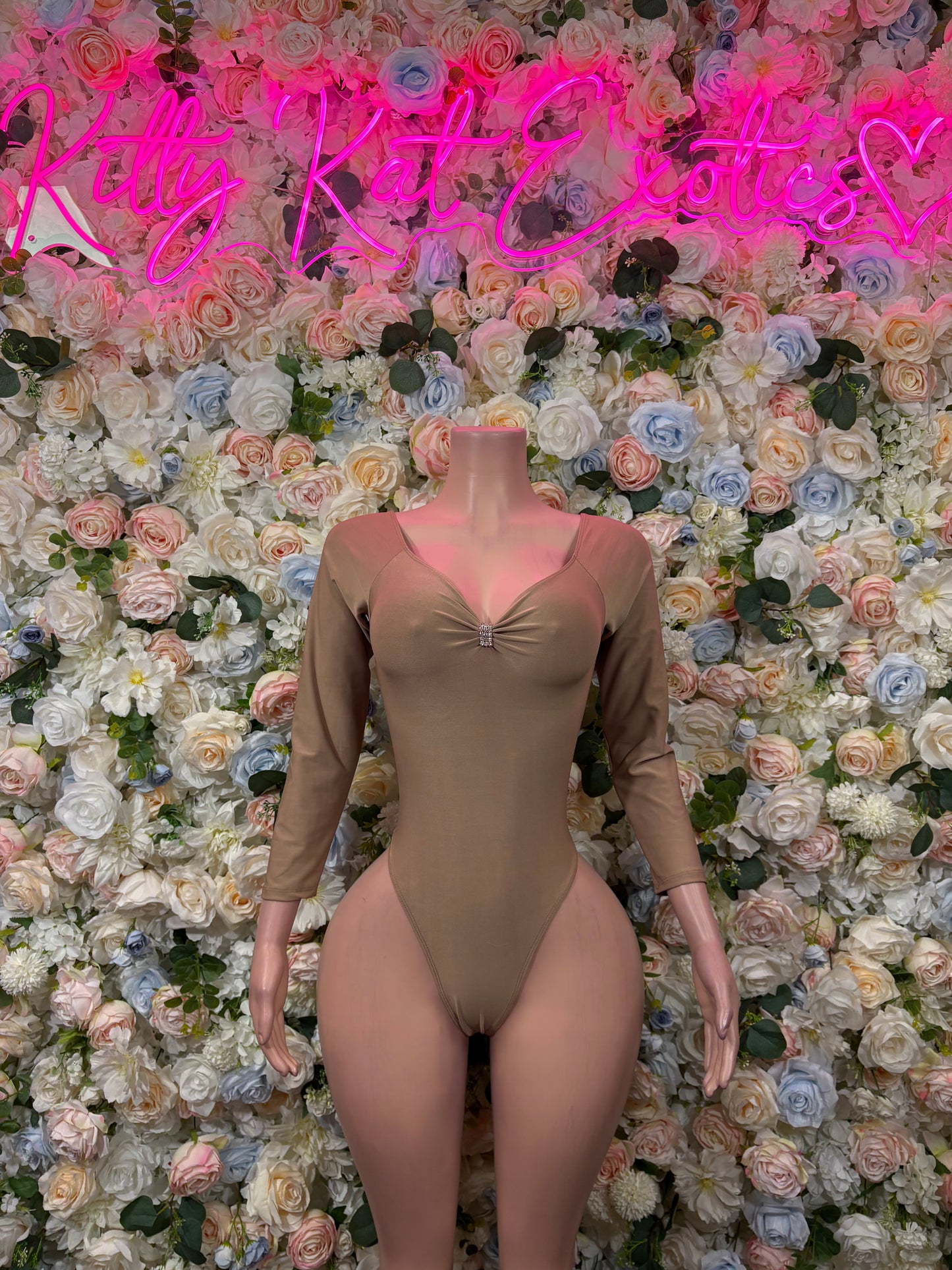 Taupe long-sleeve bodysuit with square neckline and center bow, one-piece