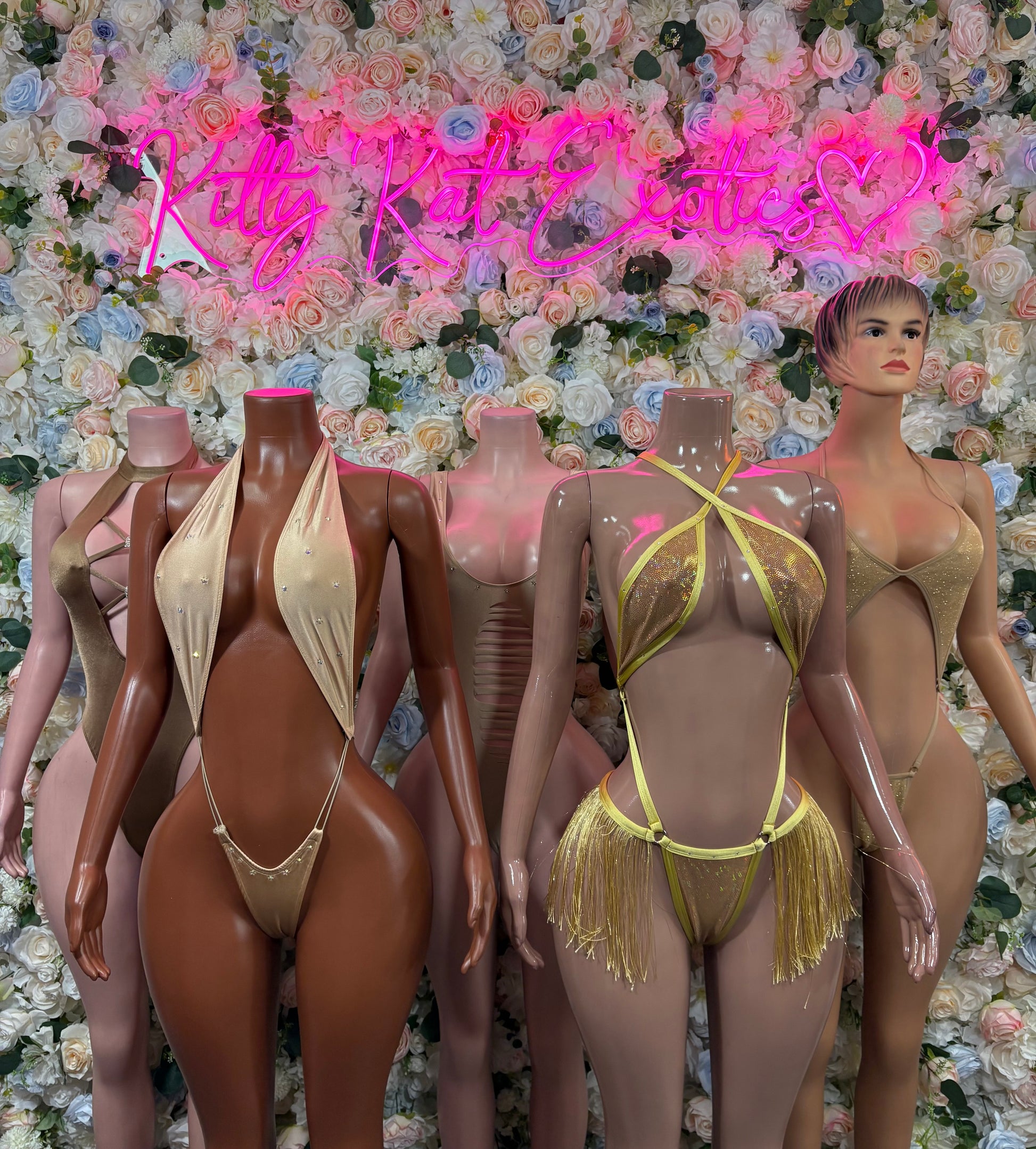 Gold fringe bodysuit set on mannequins, halter neckline with tassel hip skirt