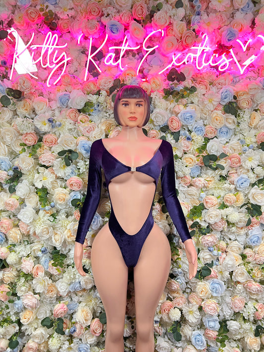 One-piece blue velvet bodysuit with long sleeves and deep V front cutout