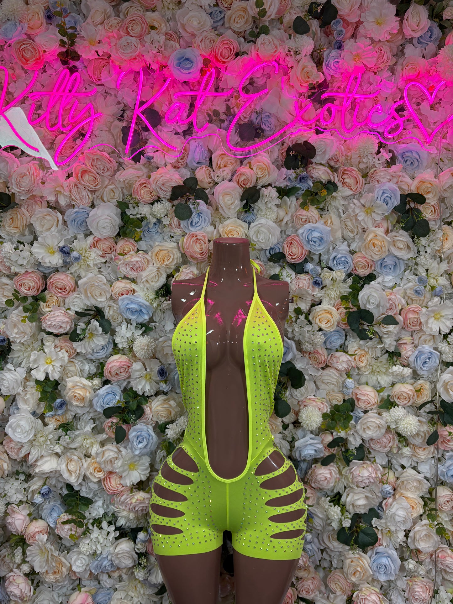 Neon green rhinestone bodysuit with spaghetti straps and high-cut legs