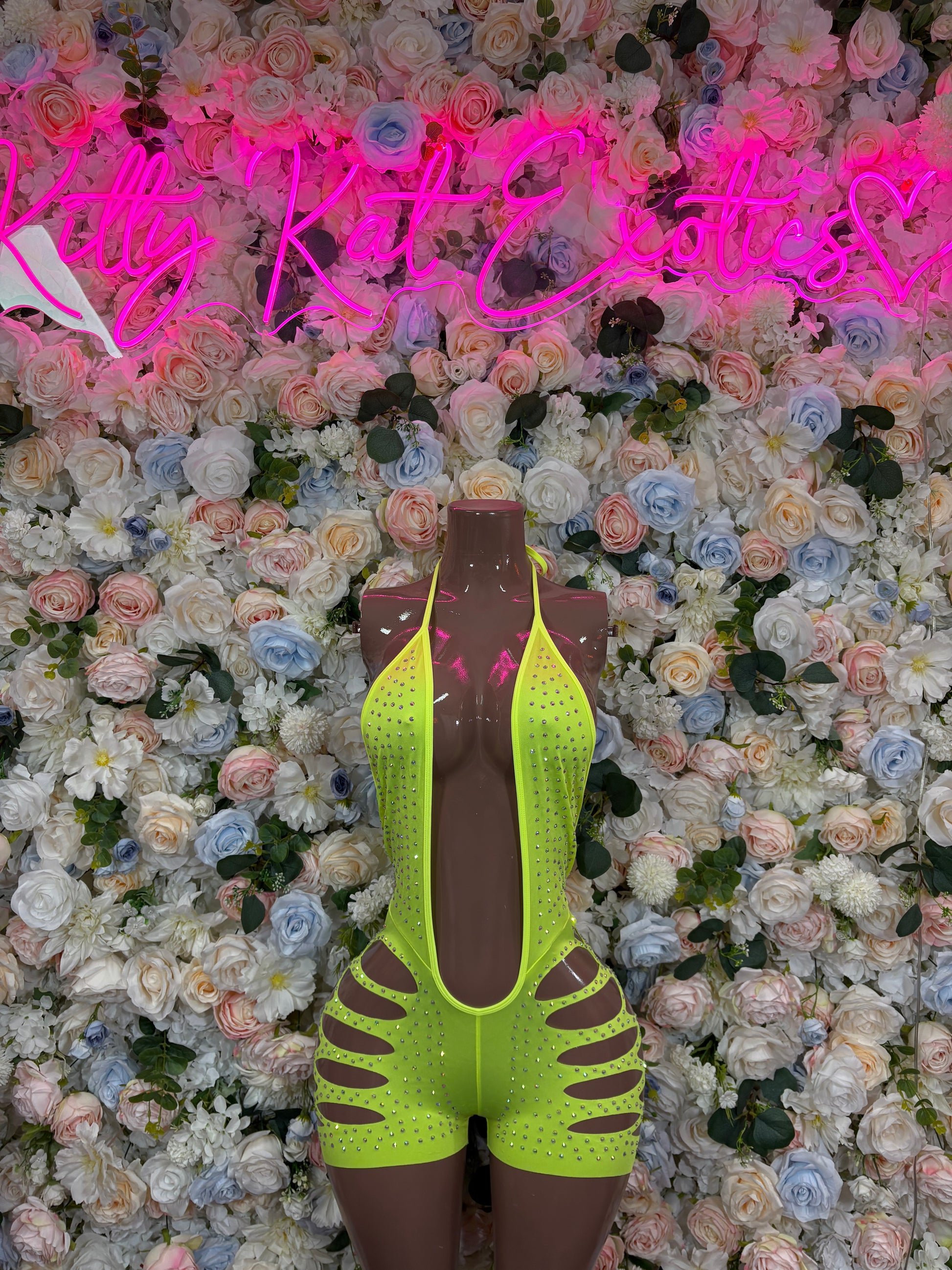 Neon green rhinestone bodysuit with spaghetti straps and high-cut legs