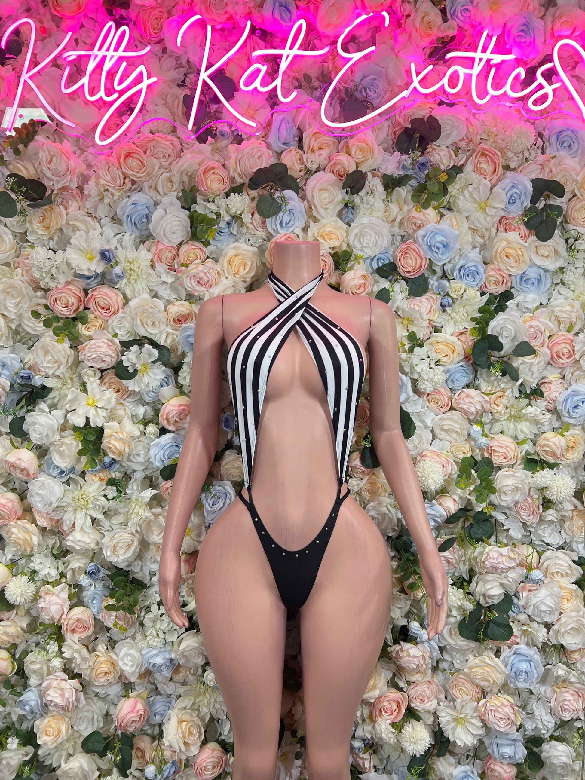 Black-and-white striped halter bodysuit with center cutout and thong bottom