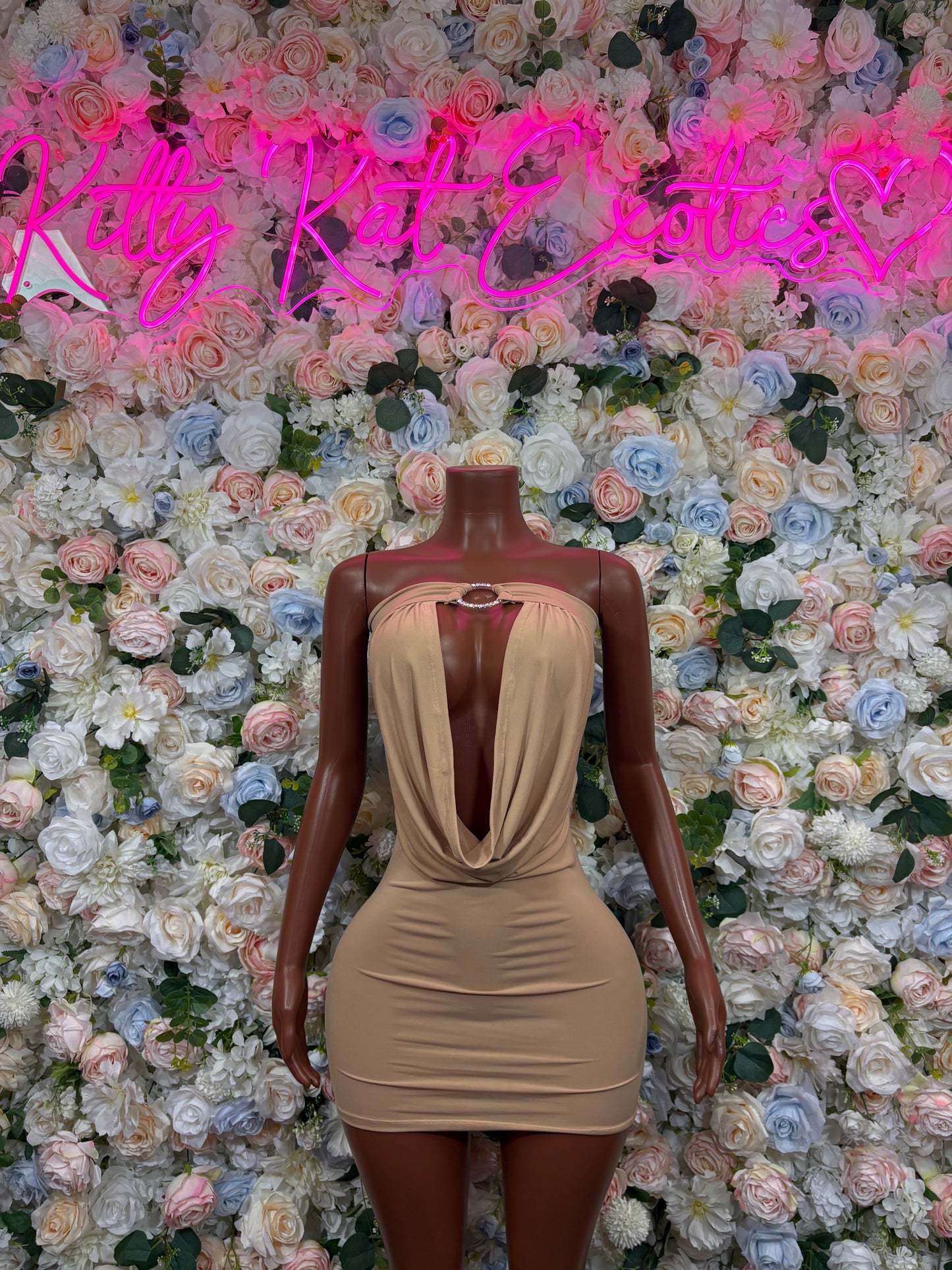 Nude dress with draped low back and ruched sleeveless bodycon fit