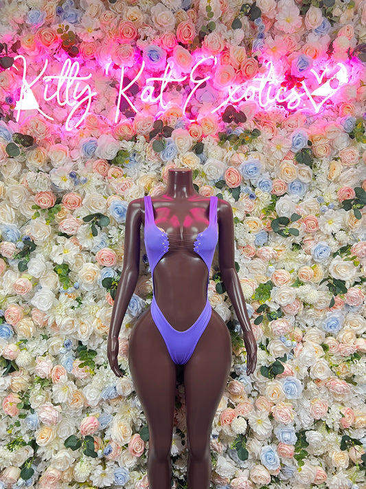 Purple one-piece bodysuit with scoop neckline and high-cut leg