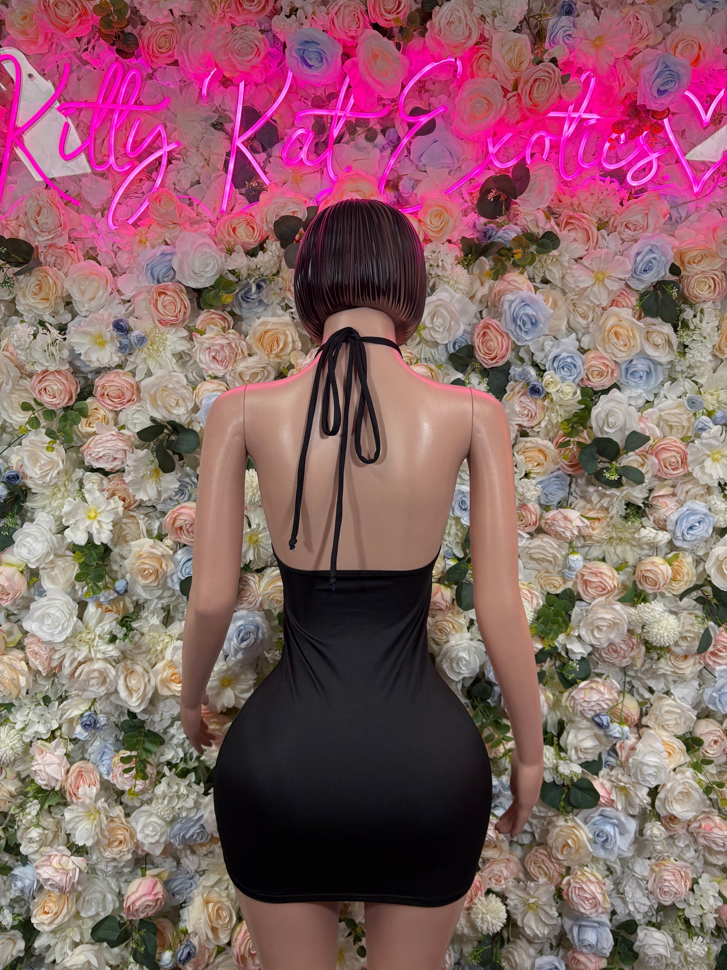 Black halter backless one-piece dress bodysuit with tie straps and gold ring detail