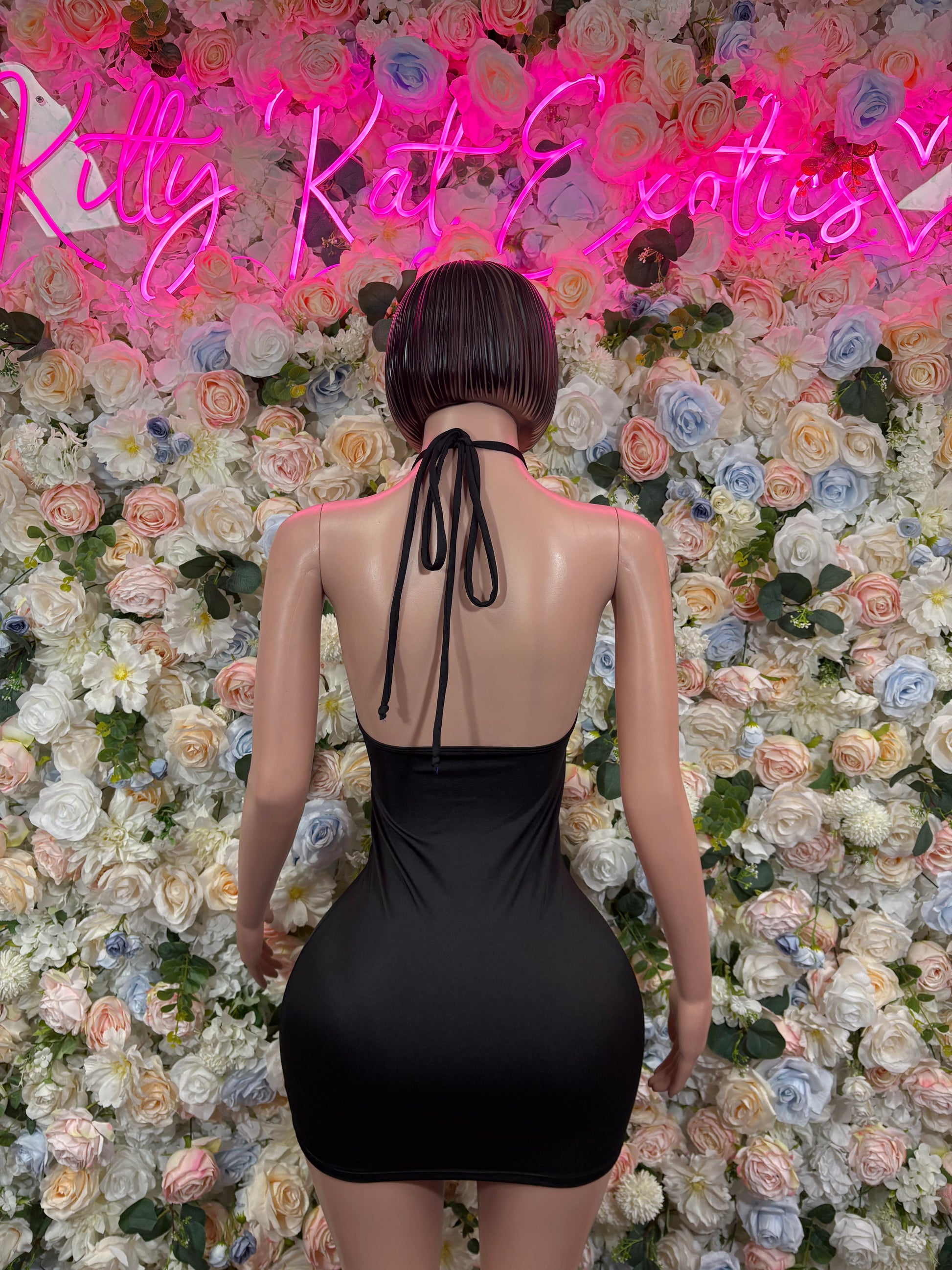 Black halter backless one-piece dress bodysuit with tie straps and gold ring detail