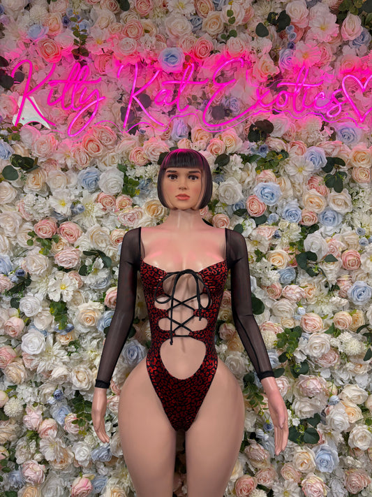 Red metallic cheetah bodysuit with sheer black long sleeves and lace-up front