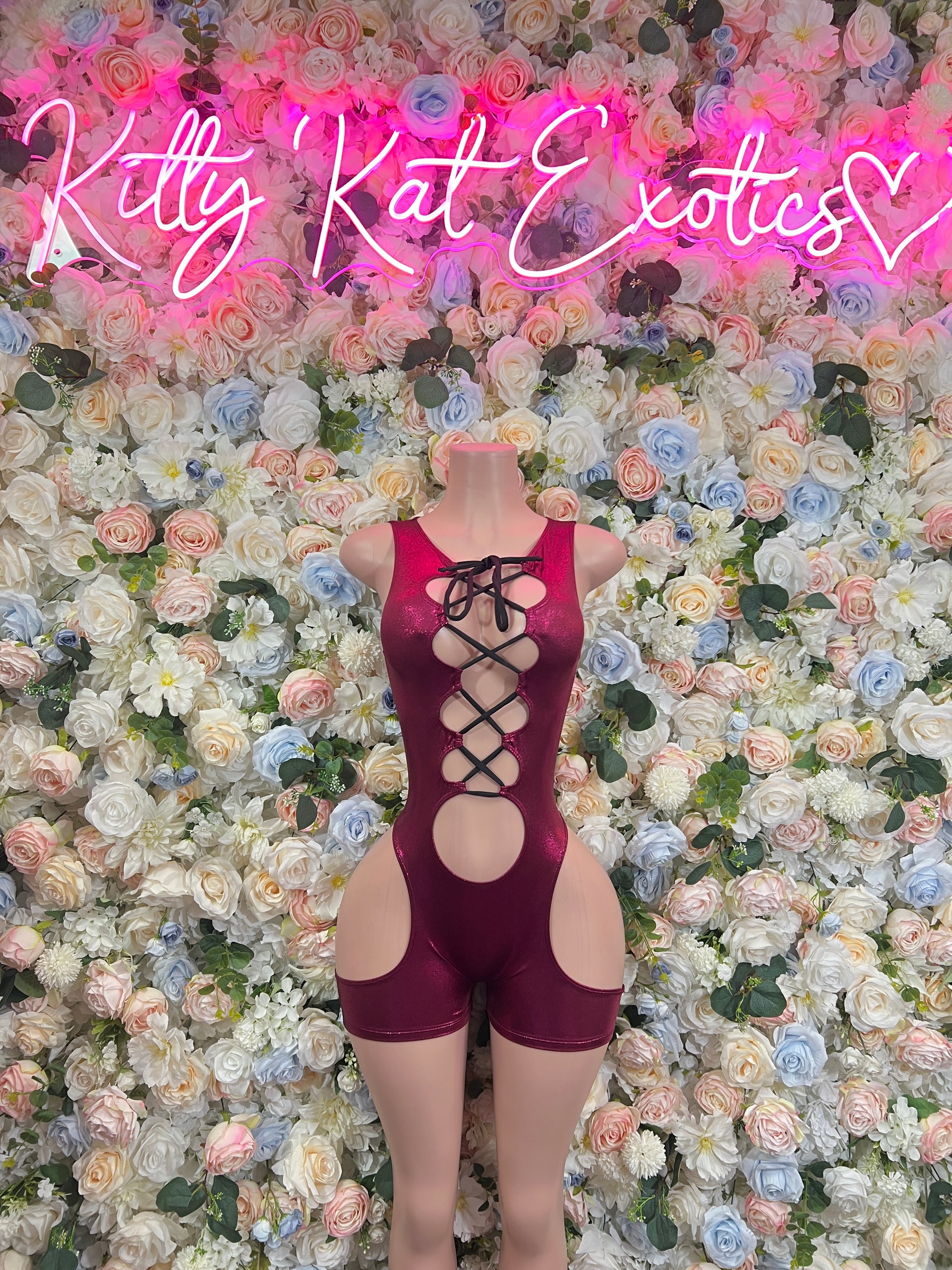 Burgundy lace-up bodysuit with front cutout and crisscross strap detail