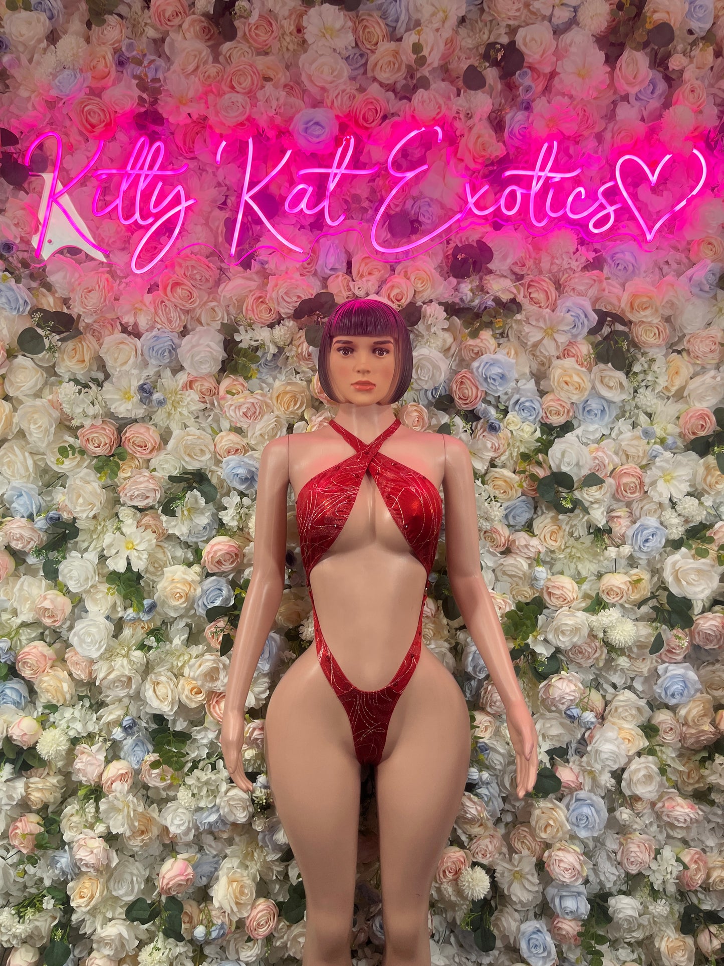 Red halter strappy bodysuit with crisscross back, high-leg one-piece