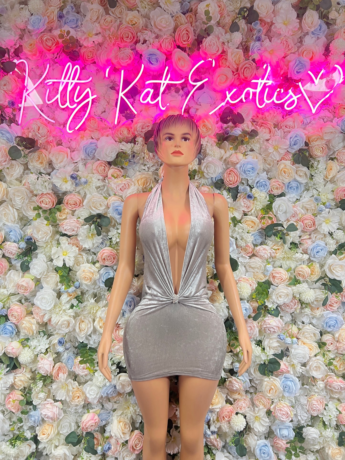 Silver velvet mini dress with deep V neckline and front knot detail