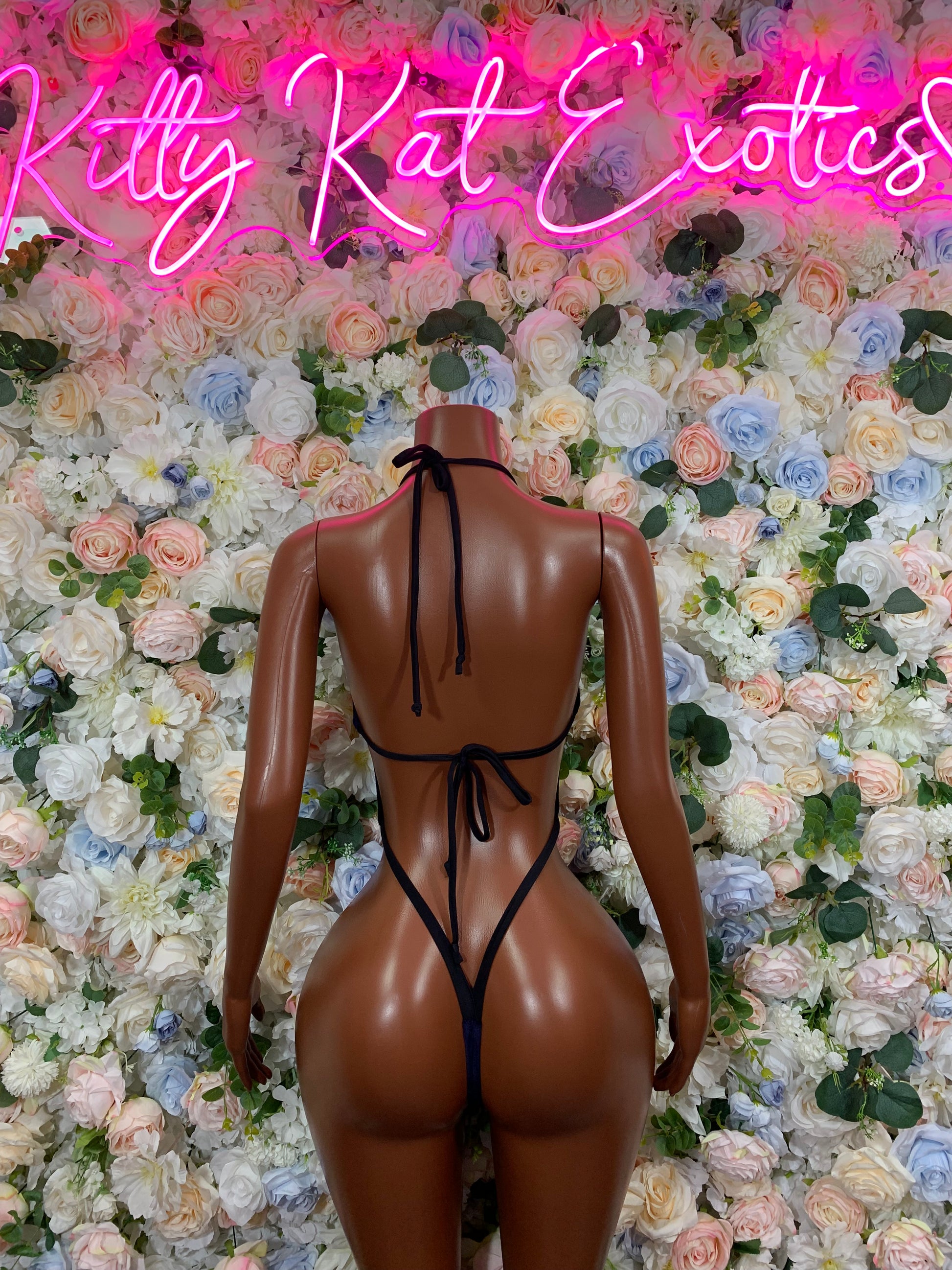 Backless dark velvet one-piece bodysuit with crisscross tie straps