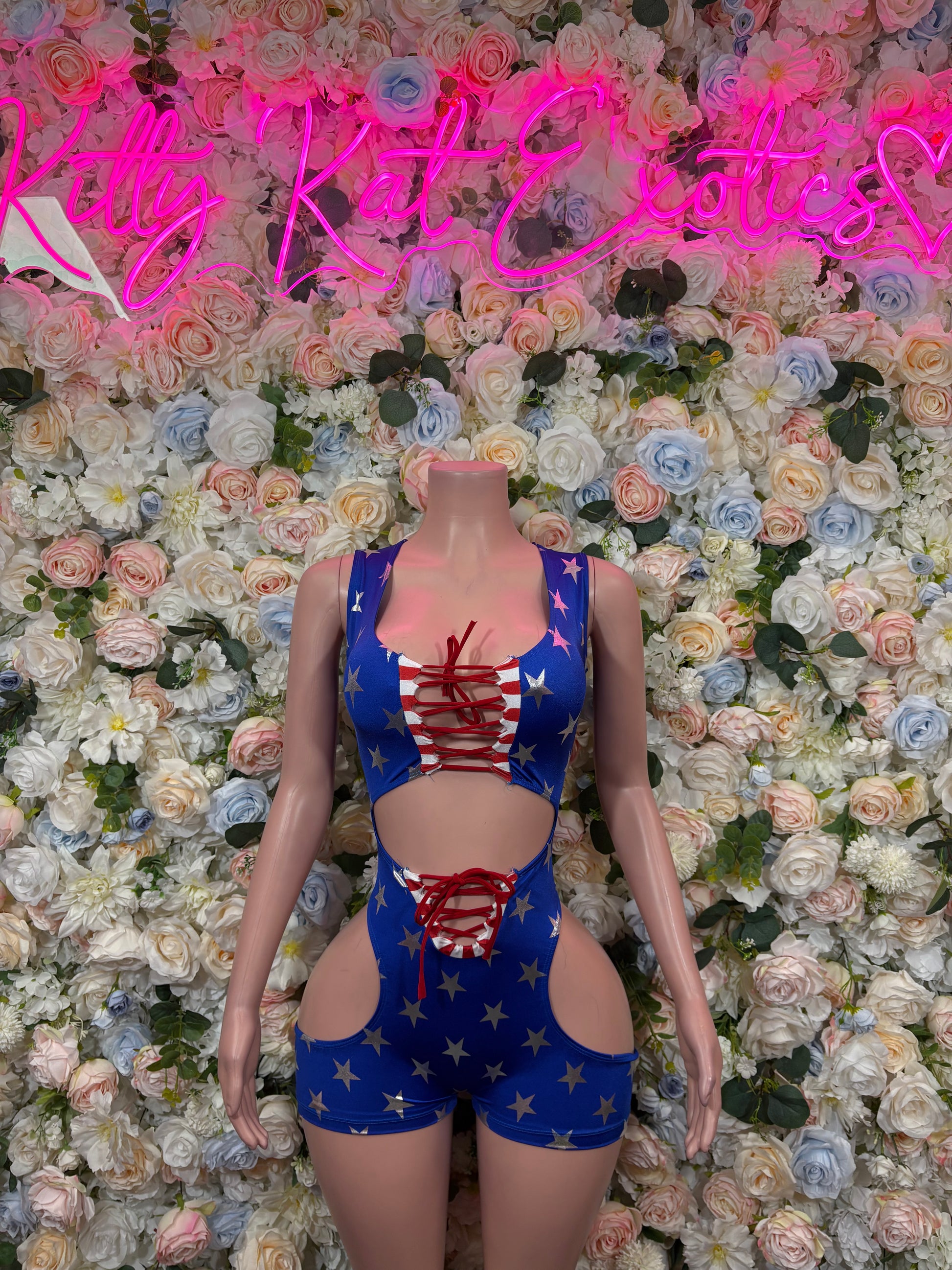 Stars-and-stripes bodysuit with red center print and heart-shaped lower cutout