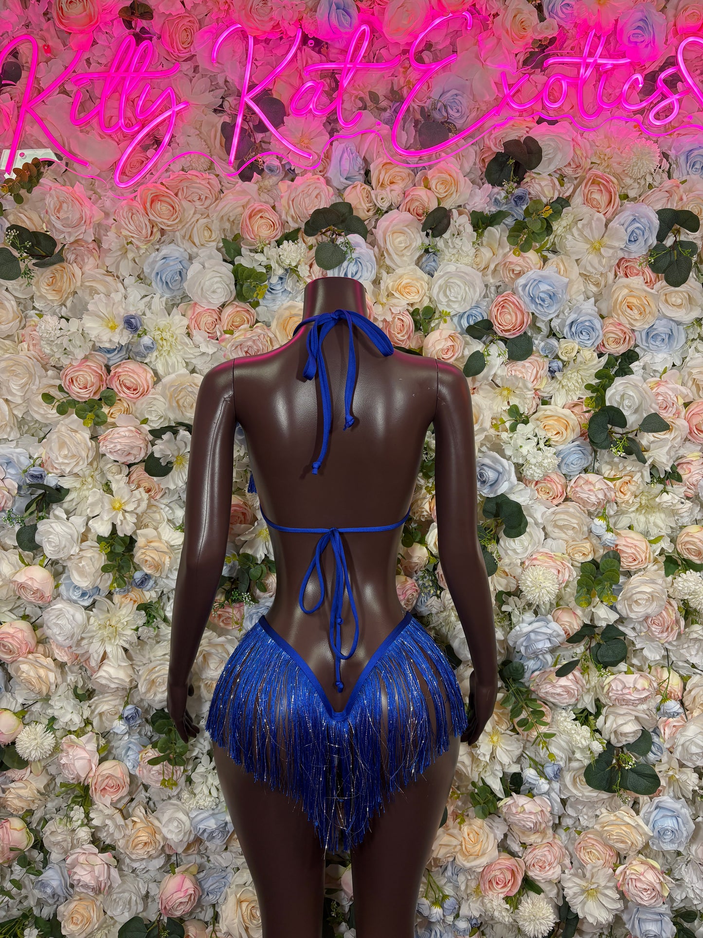 Blue halter bikini set with tie-back strings and matching blue fringe bottom