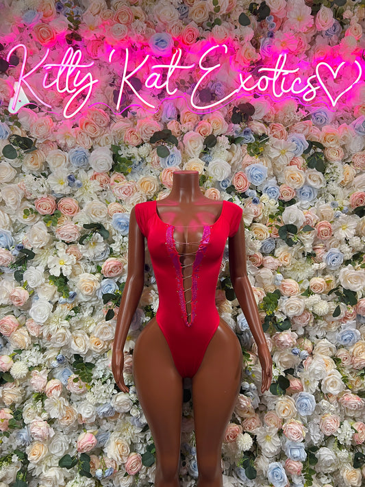 Red one-piece bodysuit with long sleeves, deep V neckline, thong cut, lace-up detail