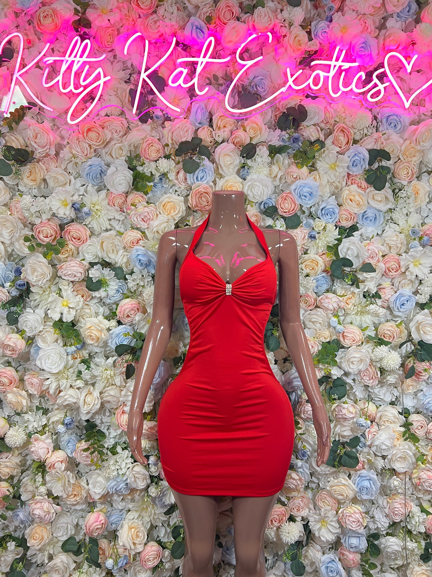 Red halter bodycon mini dress with twisted knot bust and fitted ruching