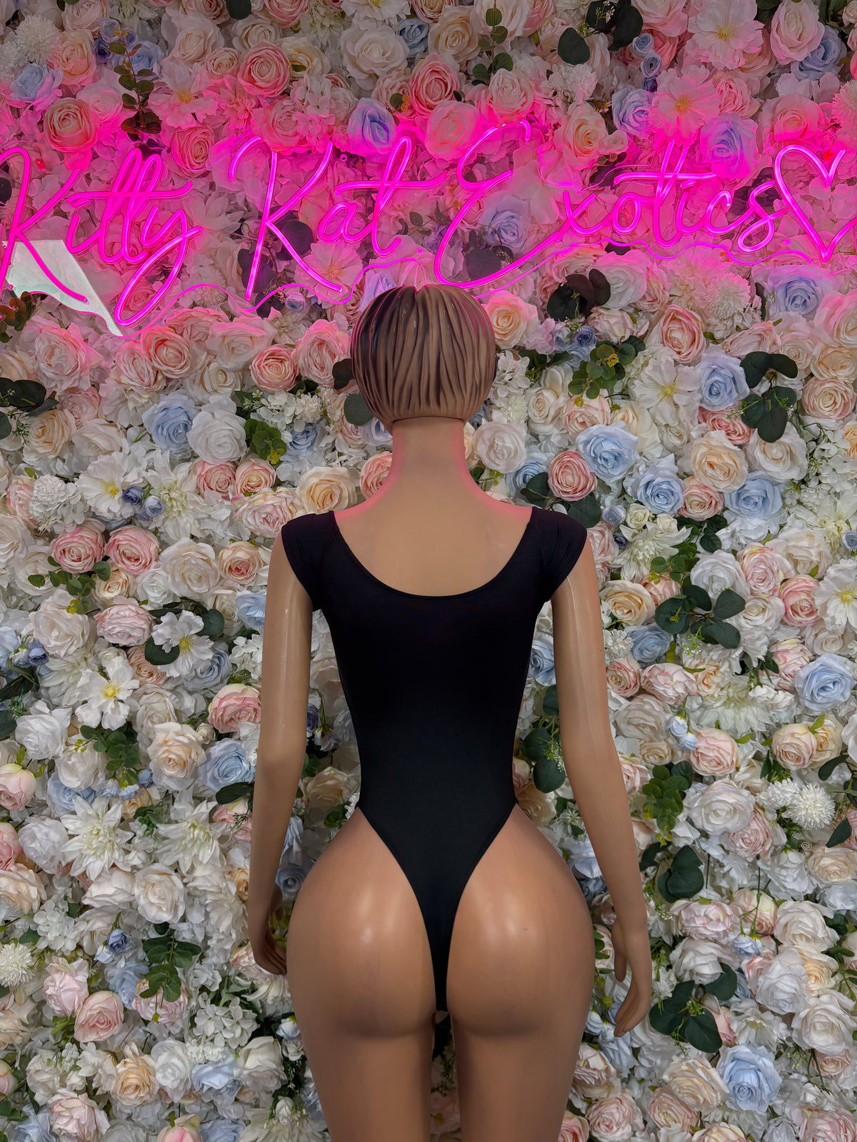 Black backless sleeveless bodysuit with scoop back and high-cut legs