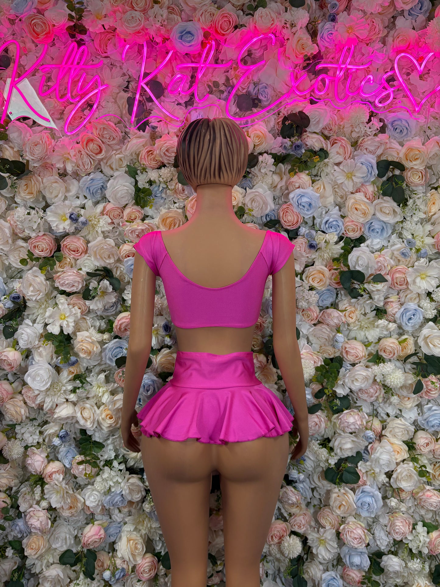 Pink ruffle skirt two-piece set with crisscrossed back and matching mini skirt