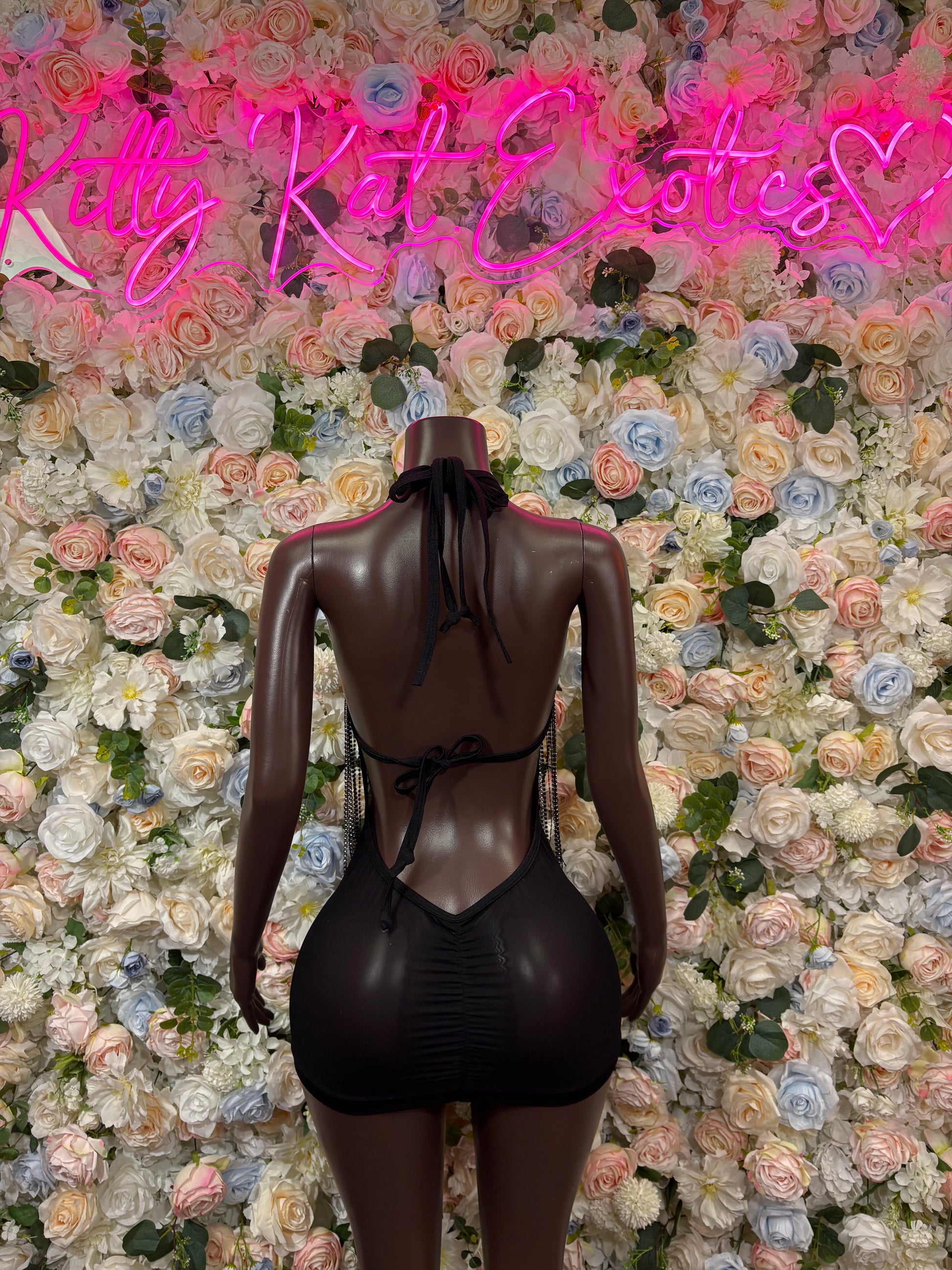 Black one-piece bodysuit dress with open back and thin straps