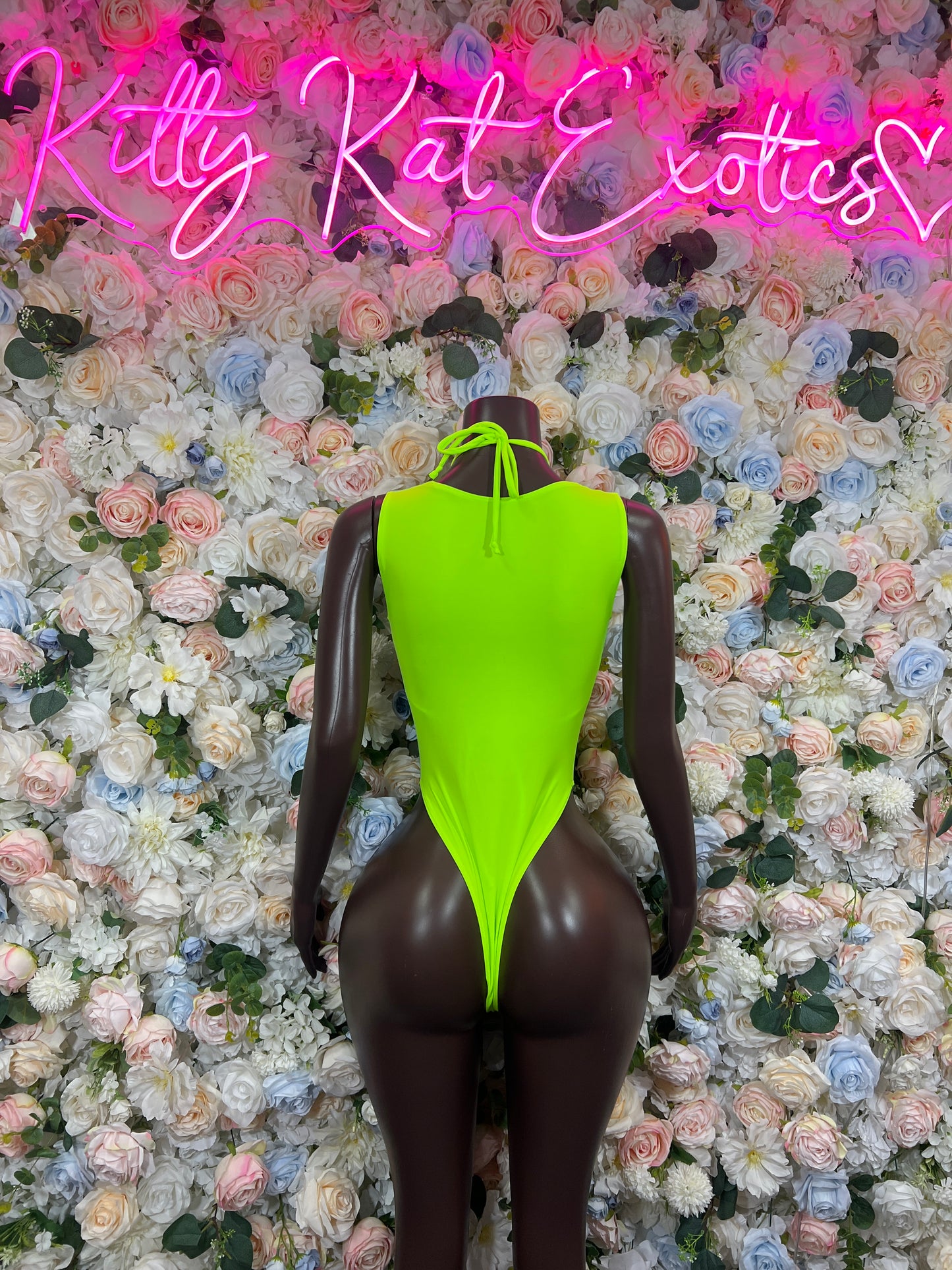 Holographic neon lace-up bodysuit with halter neckline and high-cut legs, back view