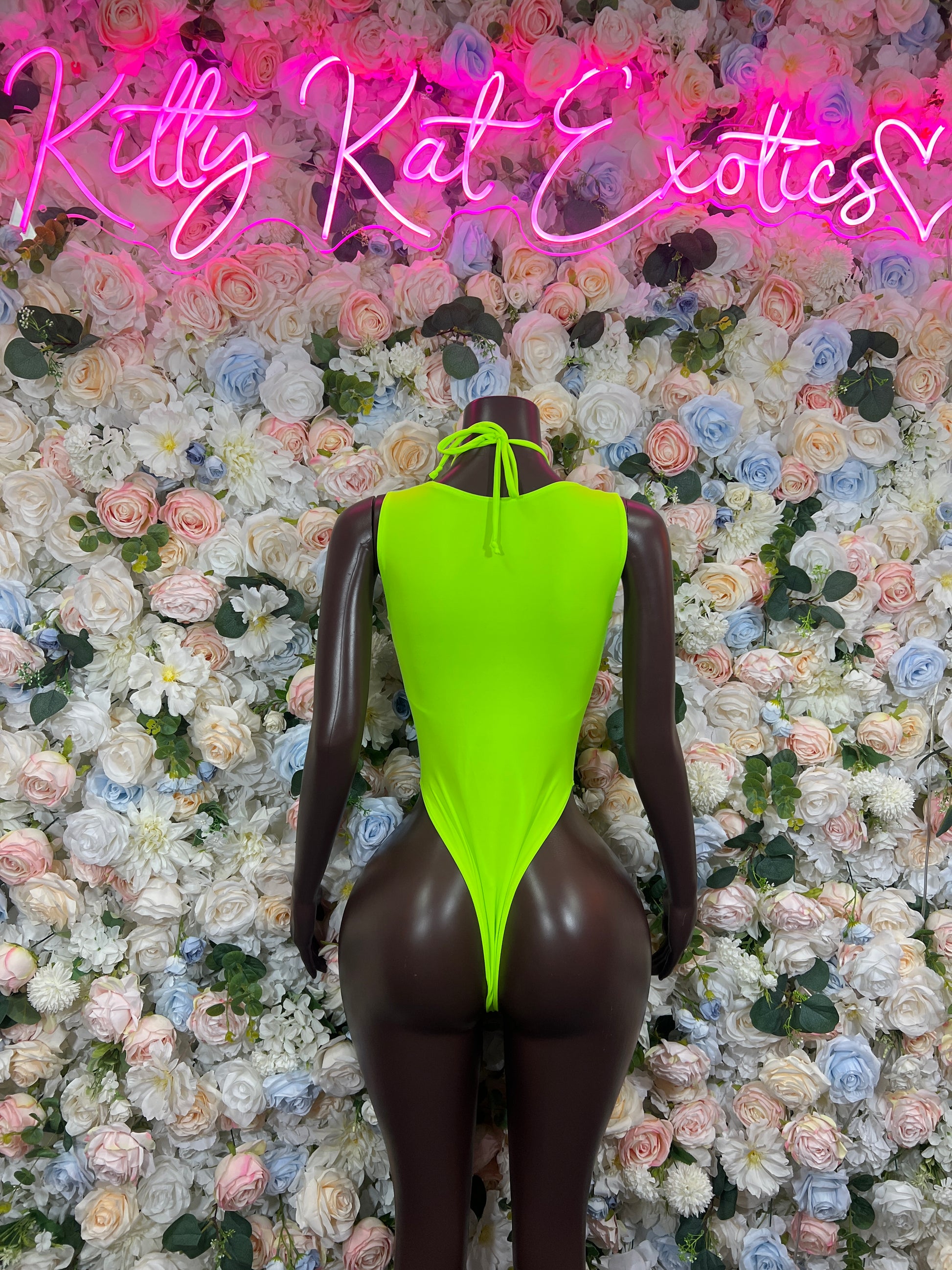 Holographic neon lace-up bodysuit with halter neckline and high-cut legs, back view