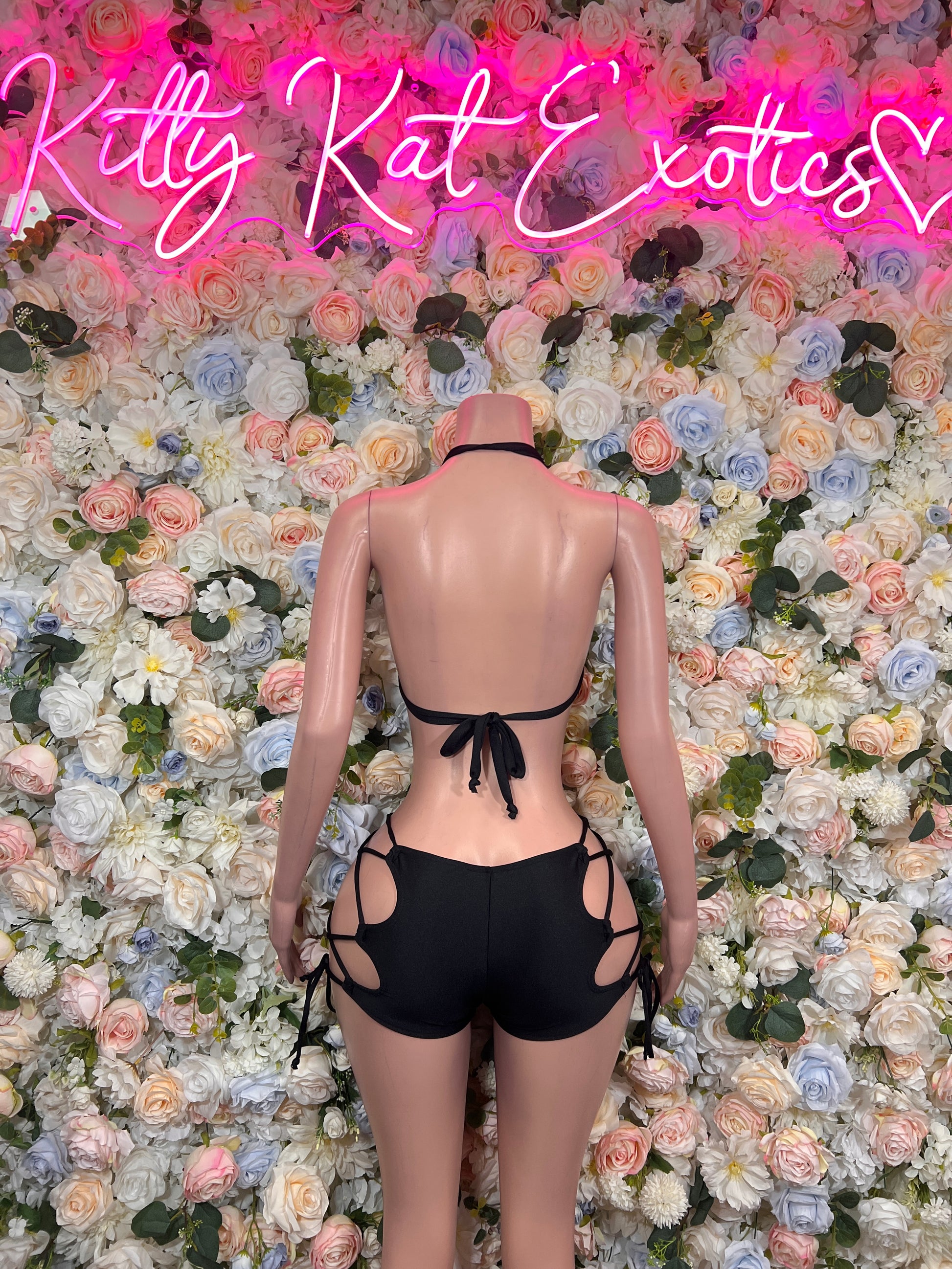 Black cutout crop top with back tie and black cutout shorts with side straps