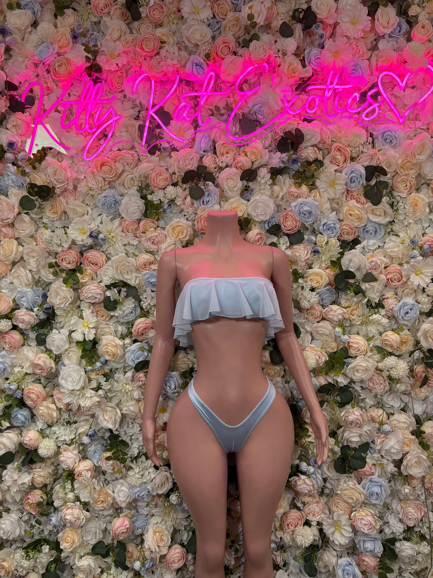 Light blue two-piece rave outfit with ruffled bandeau top and string bikini bottoms