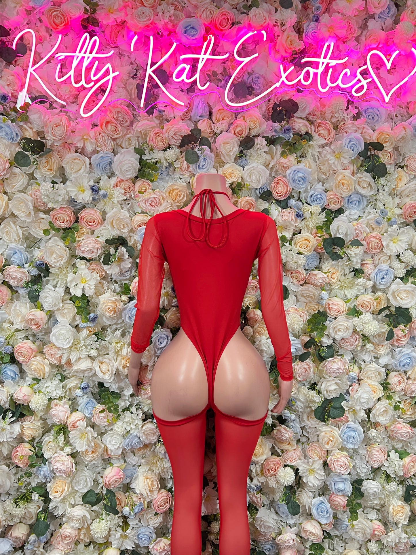 Red long-sleeve lace-up bodysuit with open back and heart detail