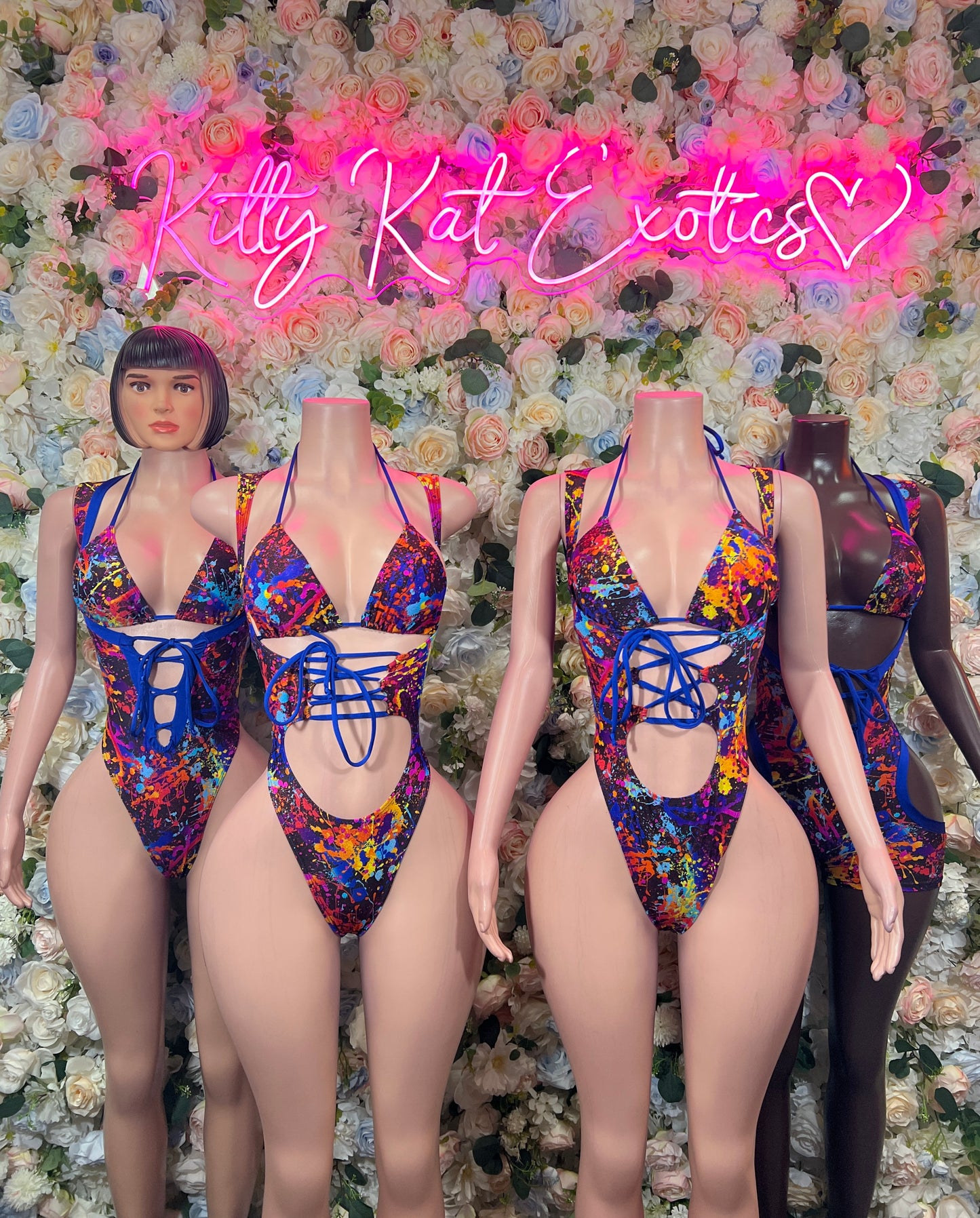 Blue and red paint-splatter strappy bodysuit with lace-up front and scoop back