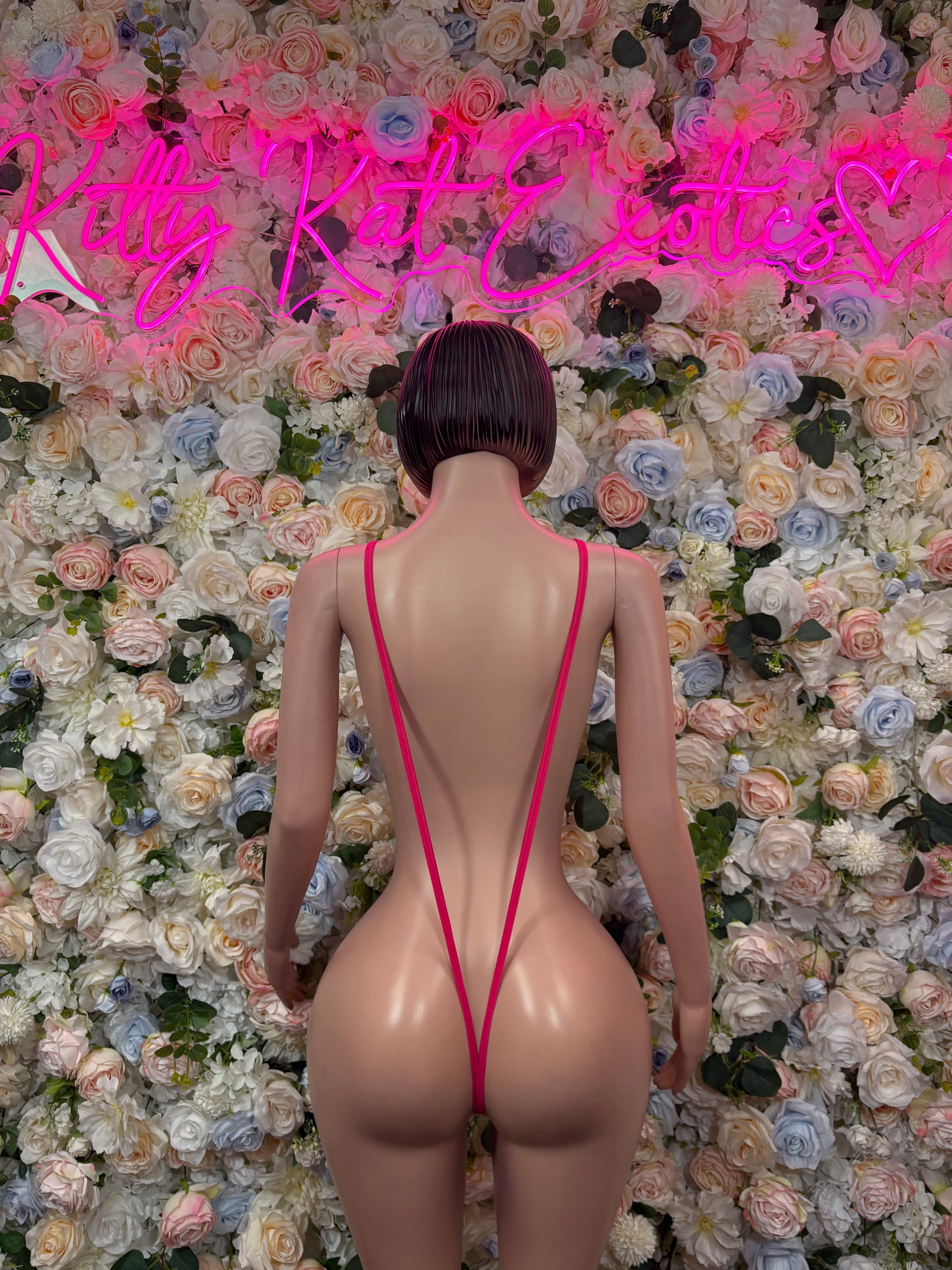 Pink strappy back one-piece bodysuit with V-shaped open back