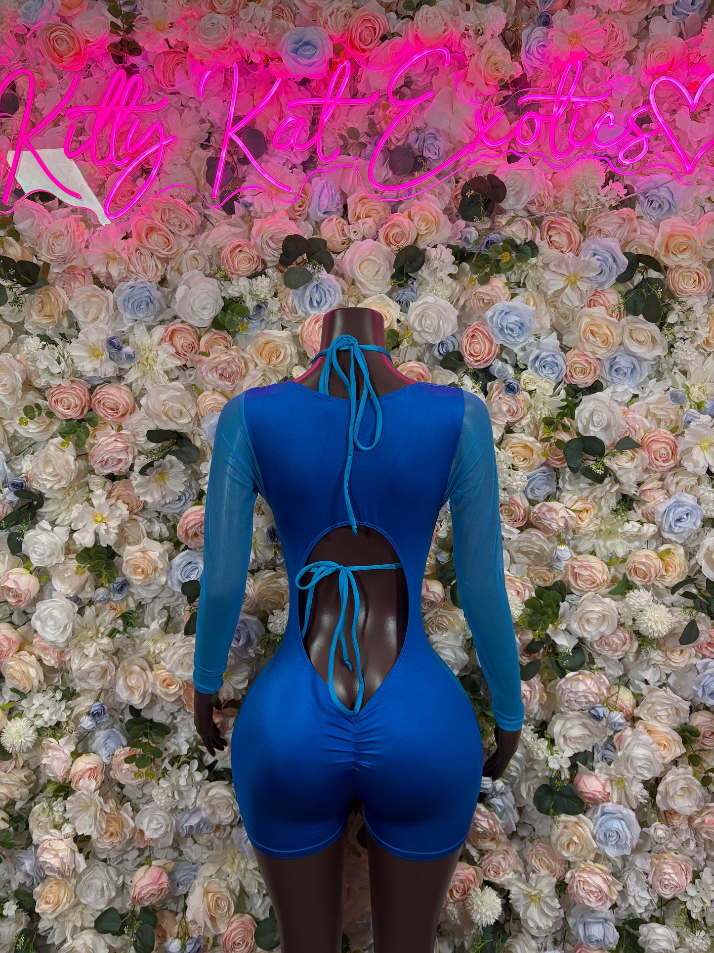 Royal blue long-sleeve bodysuit with lace-up front and high back cutout