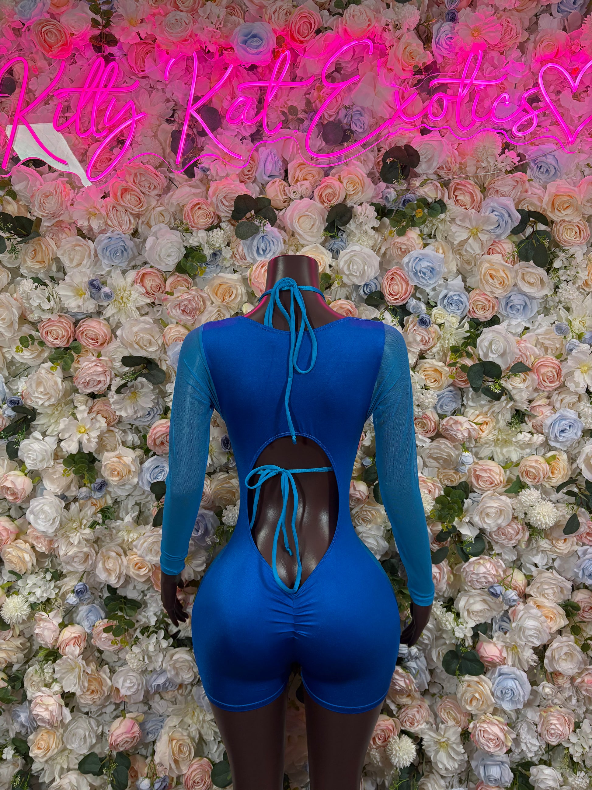 Royal blue long-sleeve bodysuit with lace-up front and high back cutout