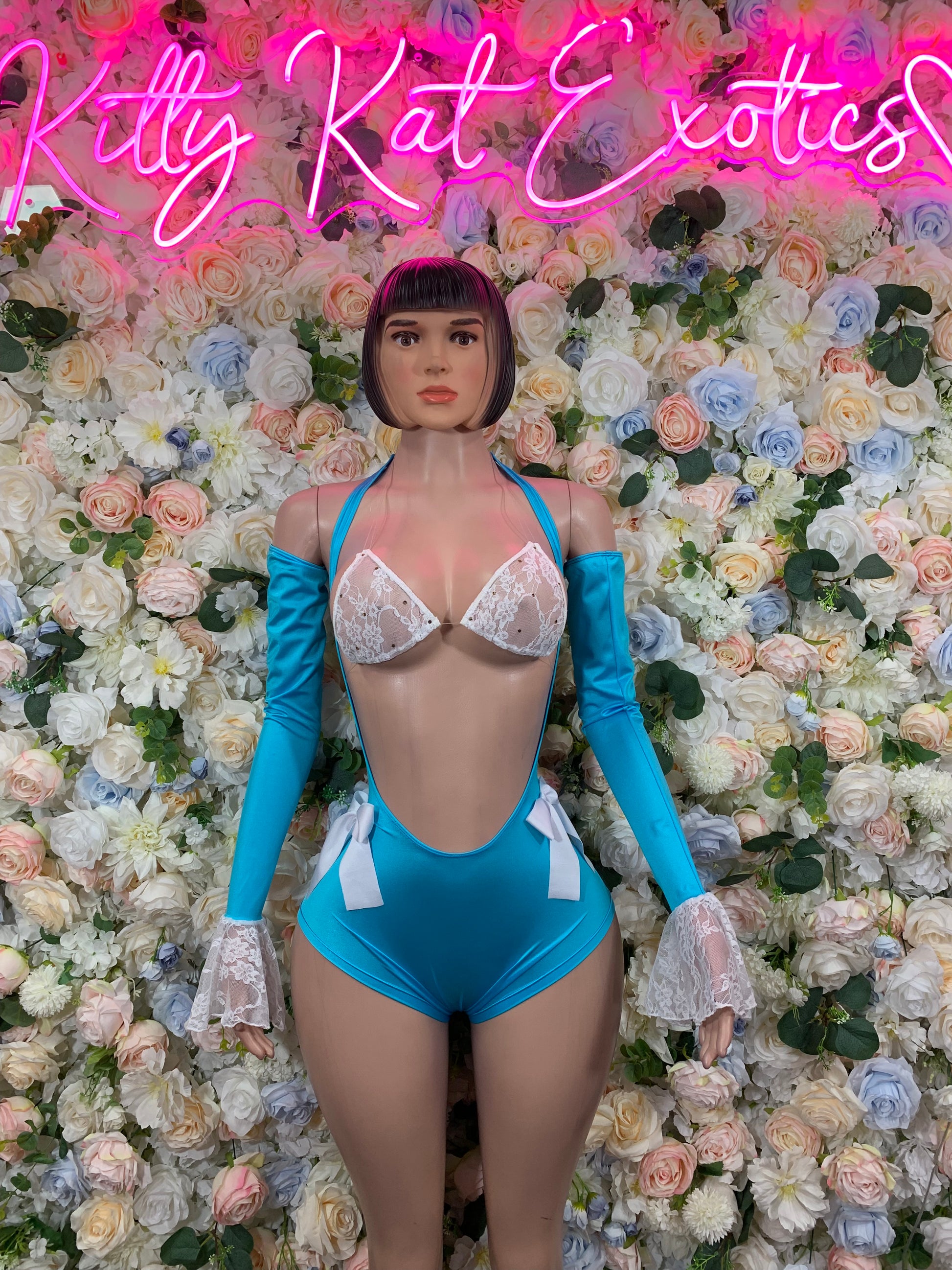 Turquoise one-piece rave bodysuit with lace-trim bra cups and lace cuff sleeves