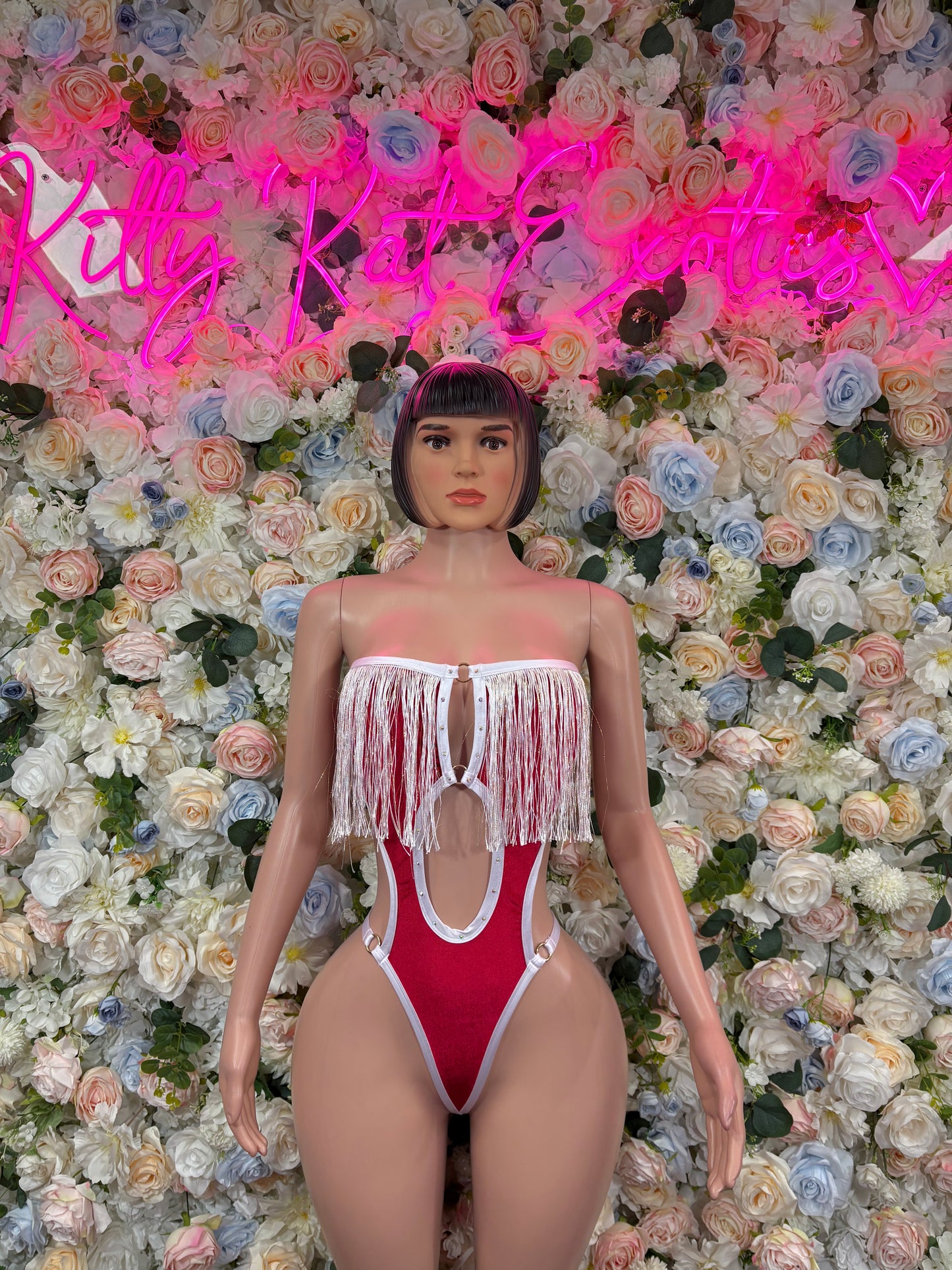 Santa-style one-piece bodysuit with red body and white fringe trim, front view