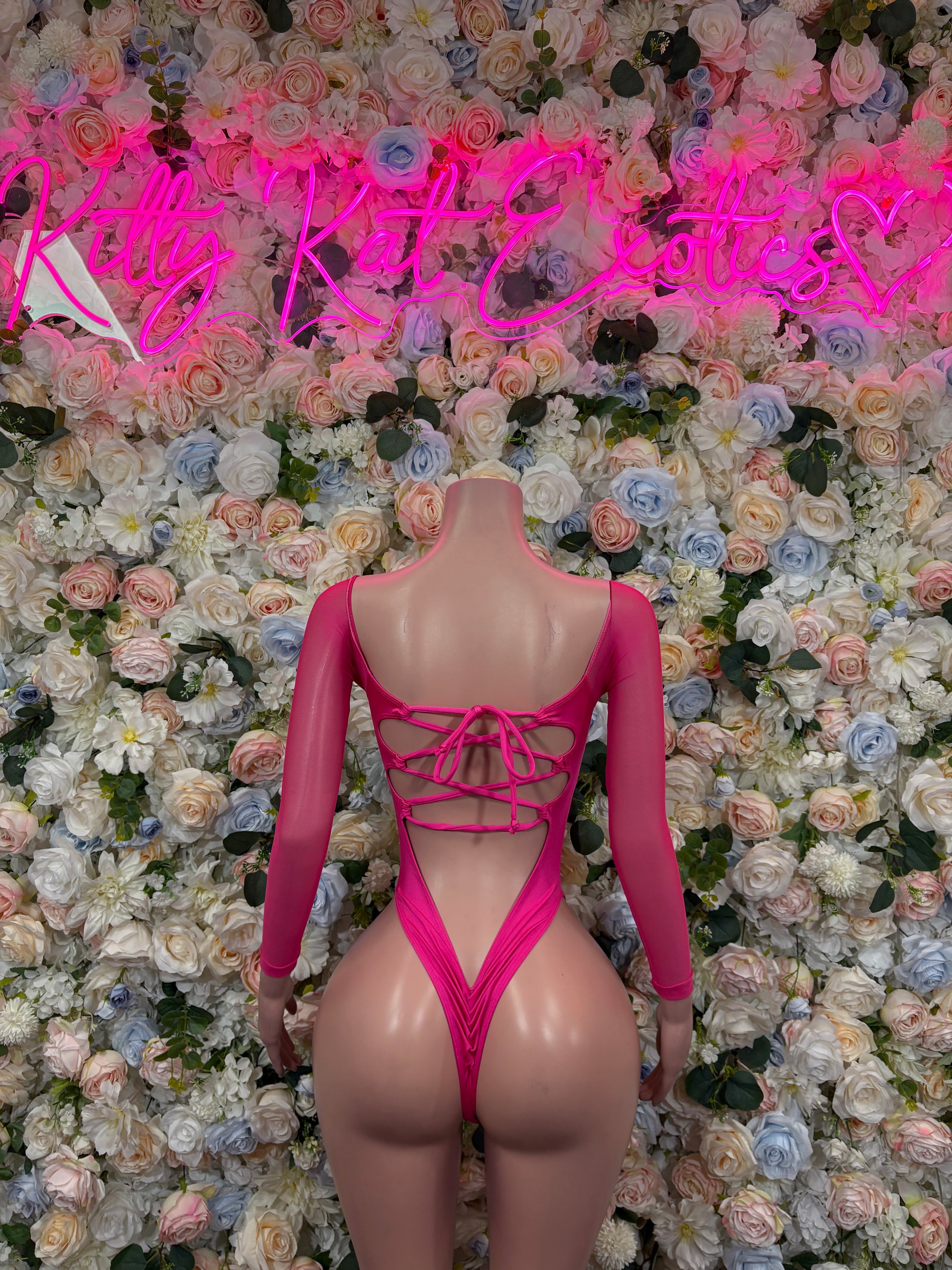 Pink metallic hologram long-sleeve bodysuit with crisscross open-back tie detail