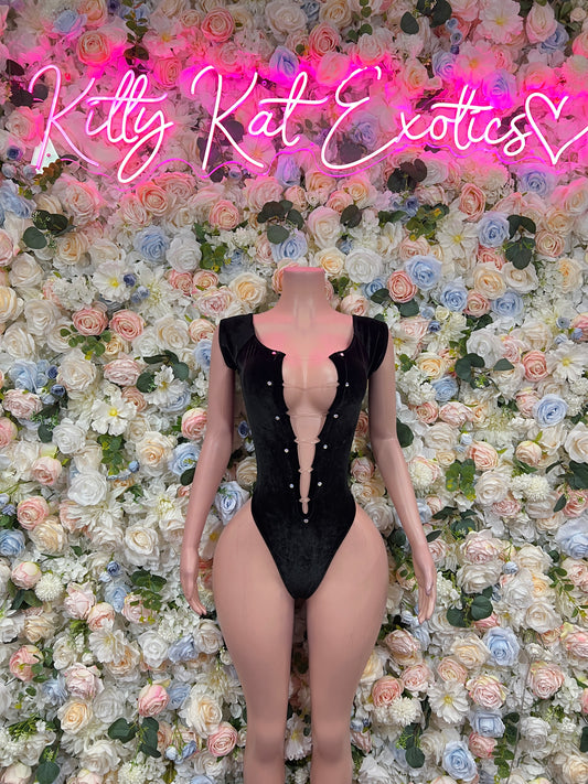 Black one-piece bodysuit with deep V neckline and strap details, front on mannequin